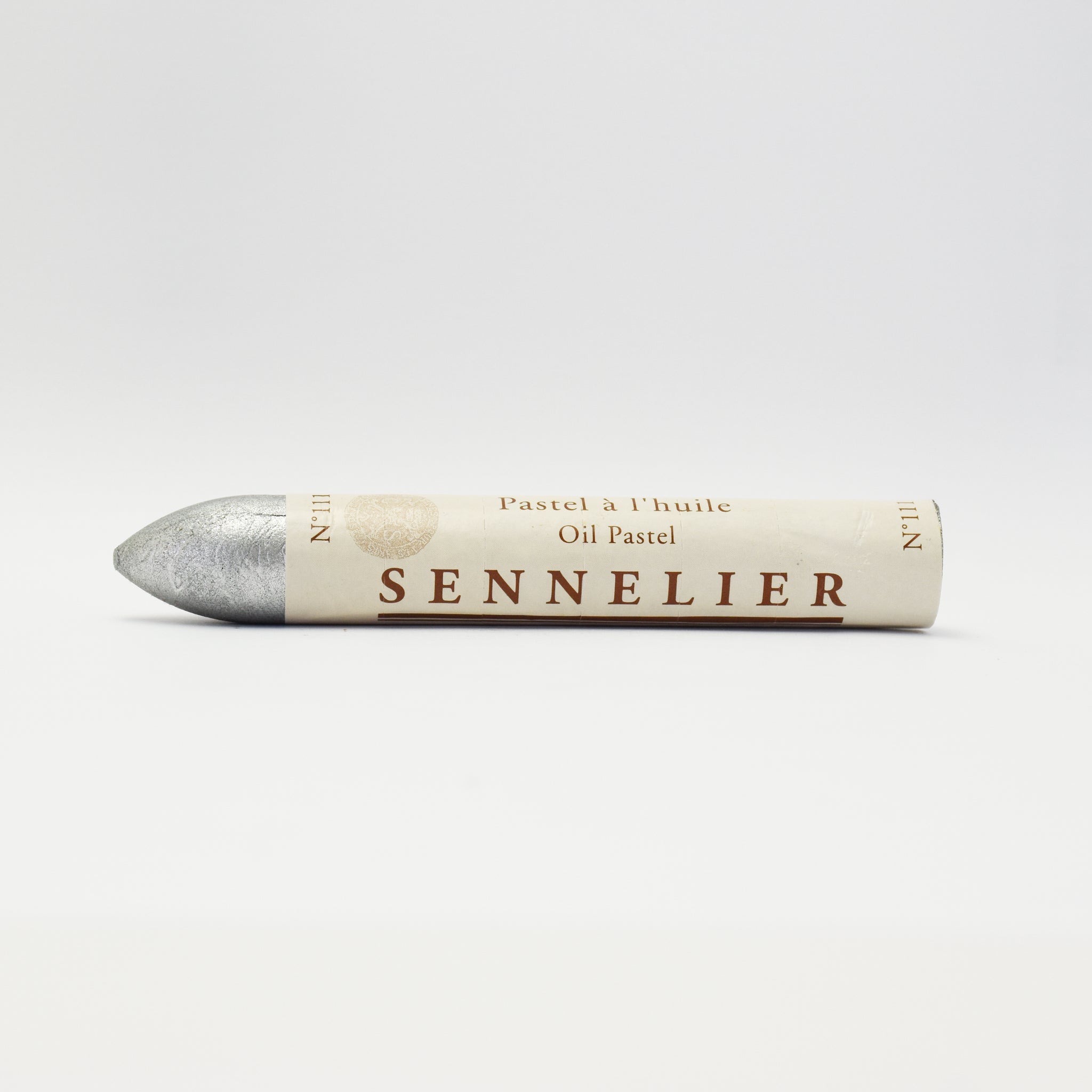 A single Sennelier oil pastel crayon against a white background, displaying the brand name and the word 'Oil Pastel' on the wrapper.