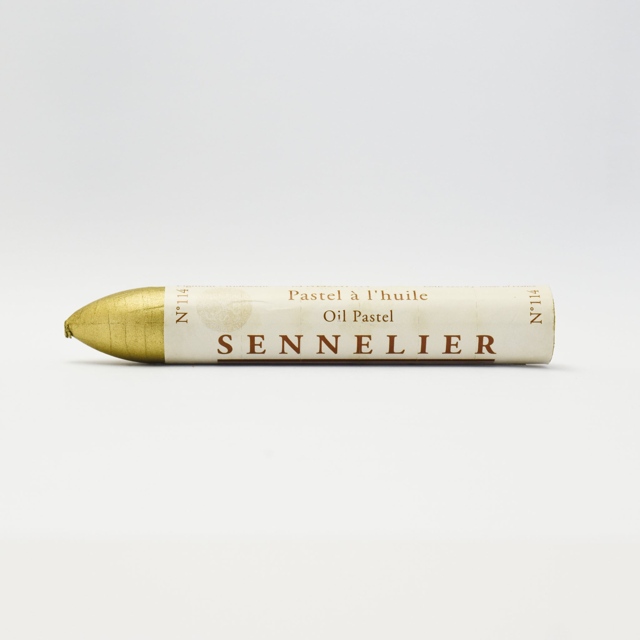 A single Sennelier oil pastel crayon against a white background, displaying the brand name and the word 'Oil Pastel' on the wrapper.