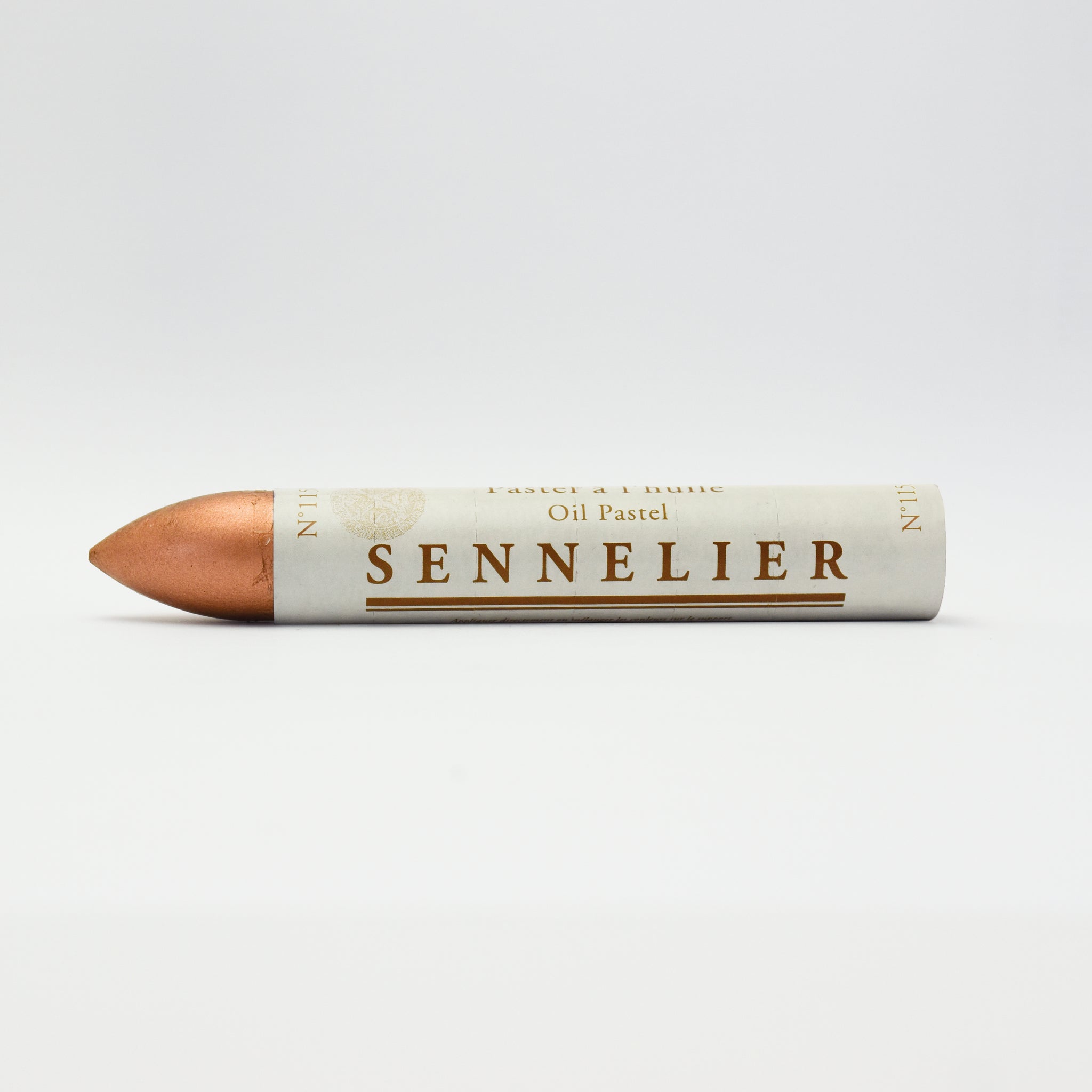 A single Sennelier oil pastel crayon against a white background, displaying the brand name and the word 'Oil Pastel' on the wrapper.