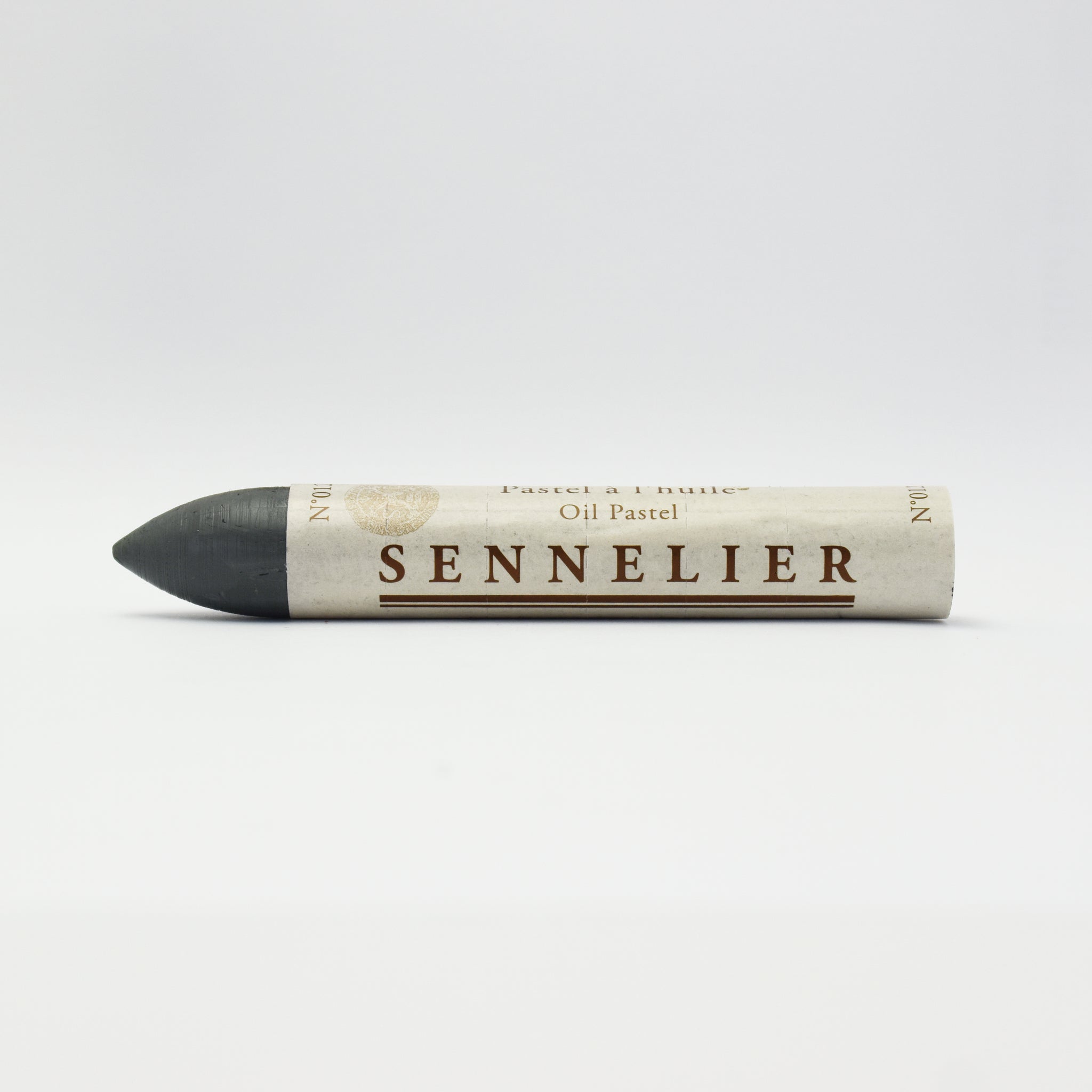 A single Sennelier oil pastel crayon against a white background, displaying the brand name and the word 'Oil Pastel' on the wrapper.