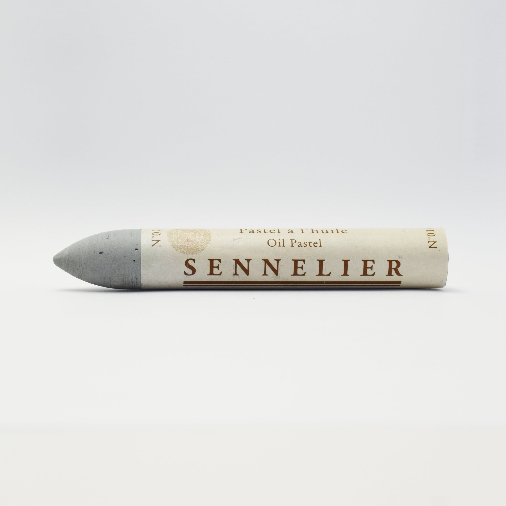 A single Sennelier oil pastel crayon against a white background, displaying the brand name and the word 'Oil Pastel' on the wrapper.