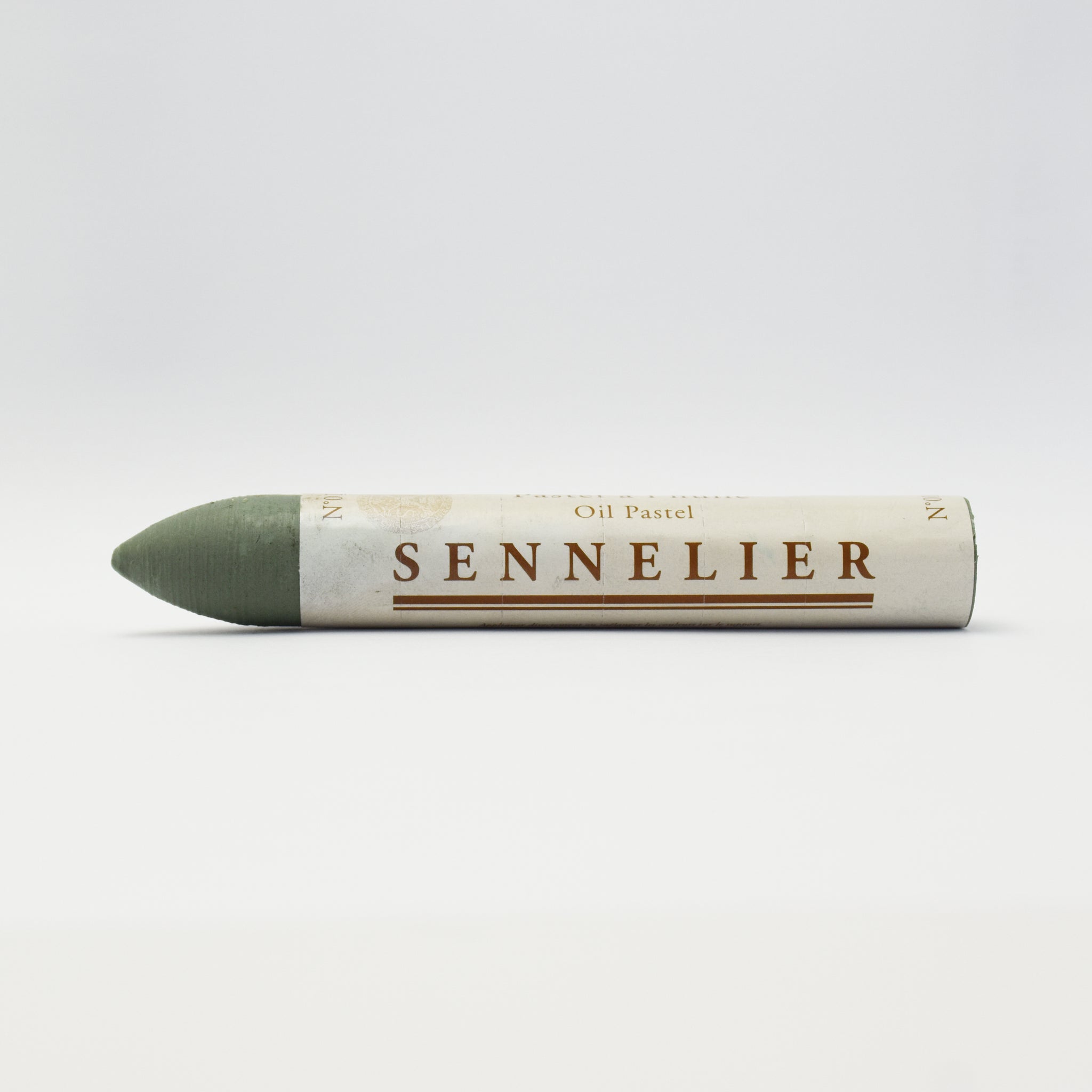 A single Sennelier oil pastel crayon against a white background, displaying the brand name and the word 'Oil Pastel' on the wrapper.