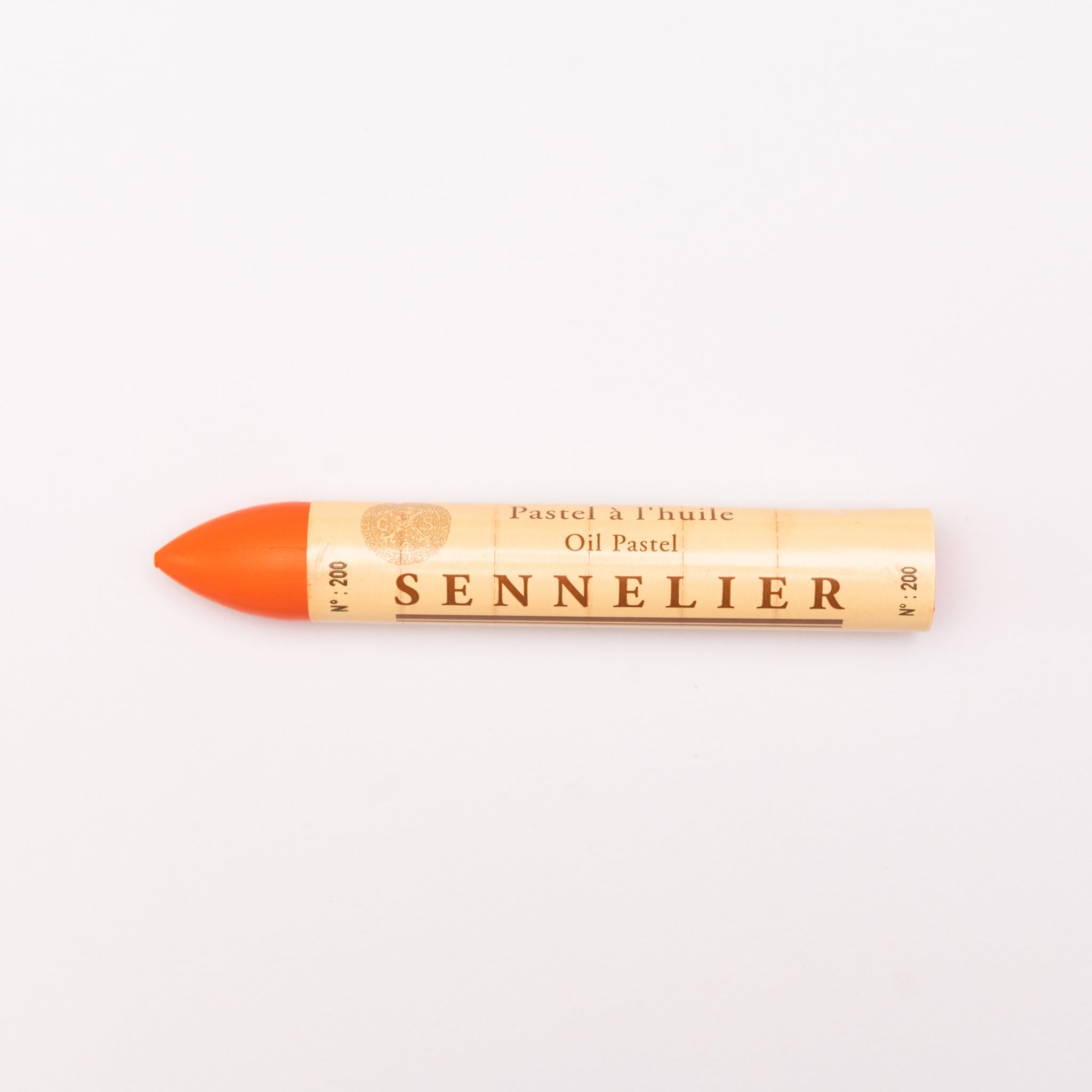 A single Sennelier oil pastel crayon against a white background, displaying the brand name and the word 'Oil Pastel' on the wrapper.