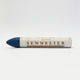 A single Sennelier oil pastel crayon against a white background, displaying the brand name and the word 'Oil Pastel' on the wrapper.
