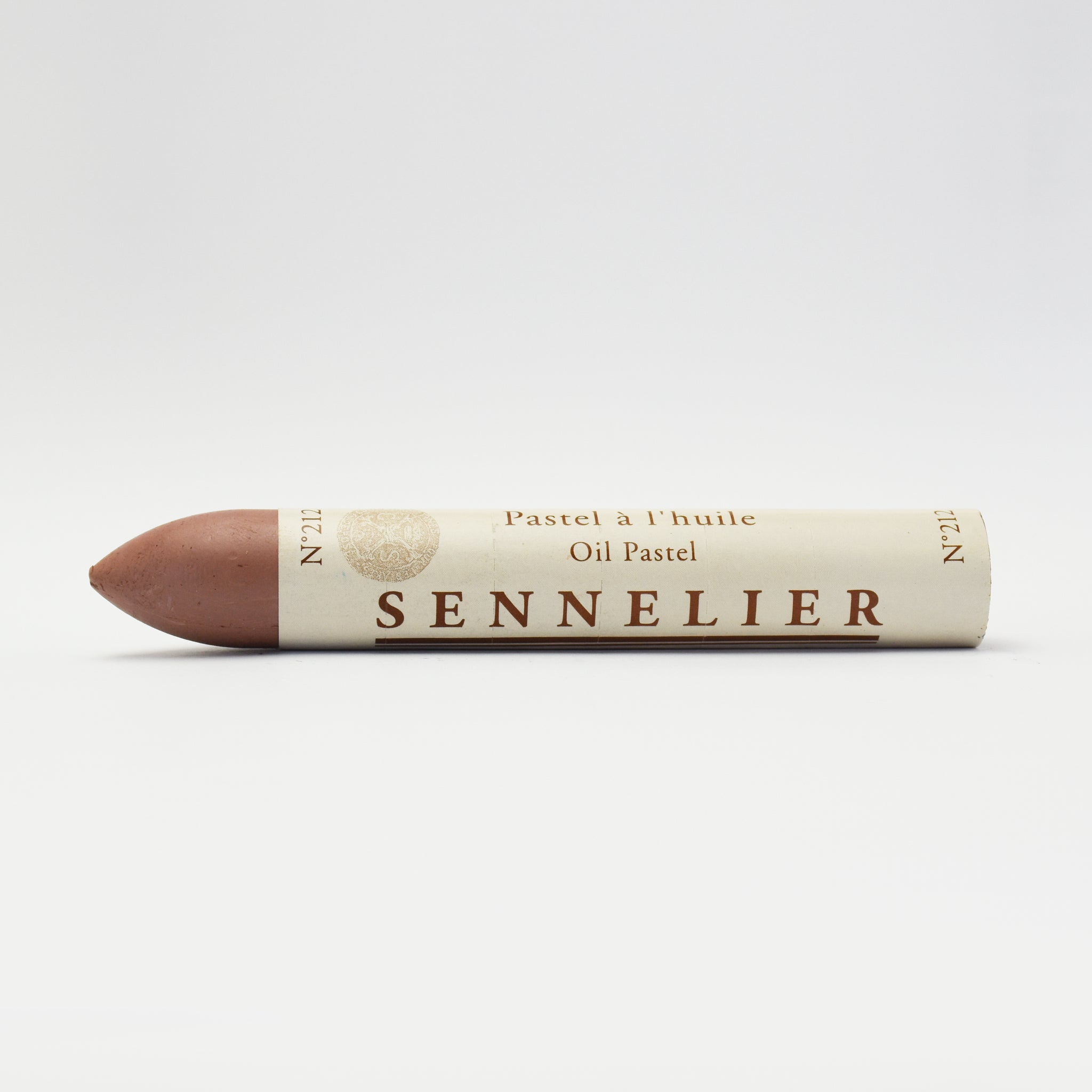 A single Sennelier oil pastel crayon against a white background, displaying the brand name and the word 'Oil Pastel' on the wrapper.