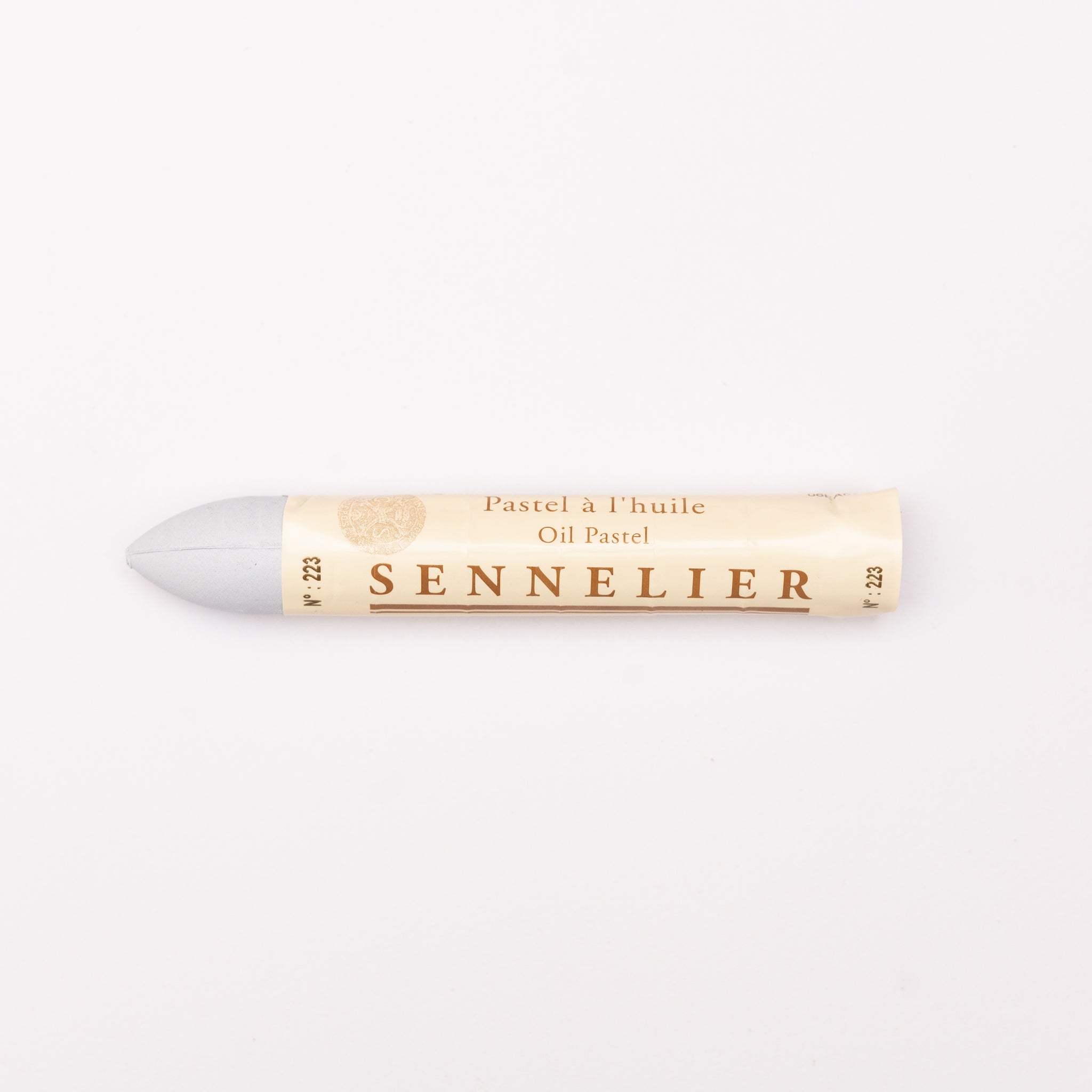 A single Sennelier oil pastel crayon against a white background, displaying the brand name and the word 'Oil Pastel' on the wrapper.