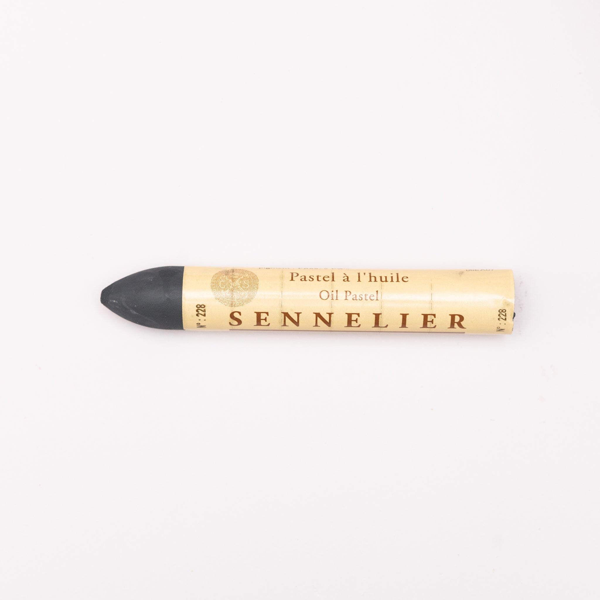 A single Sennelier oil pastel crayon against a white background, displaying the brand name and the word 'Oil Pastel' on the wrapper.