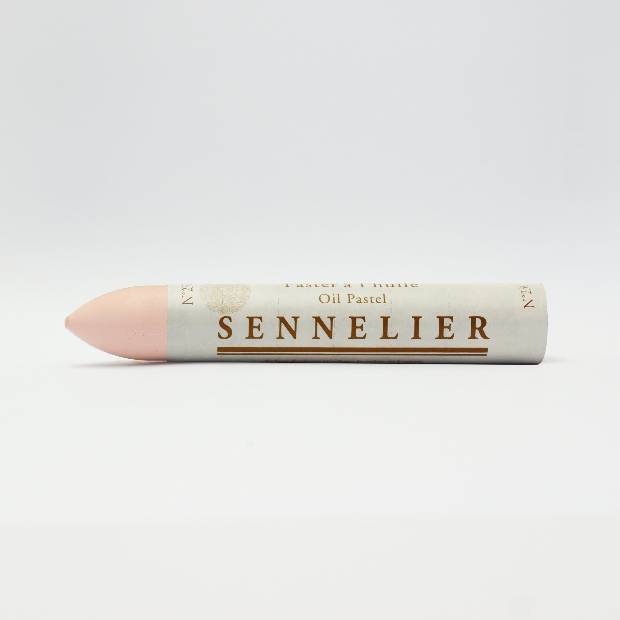 A single Sennelier oil pastel crayon against a white background, displaying the brand name and the word 'Oil Pastel' on the wrapper.