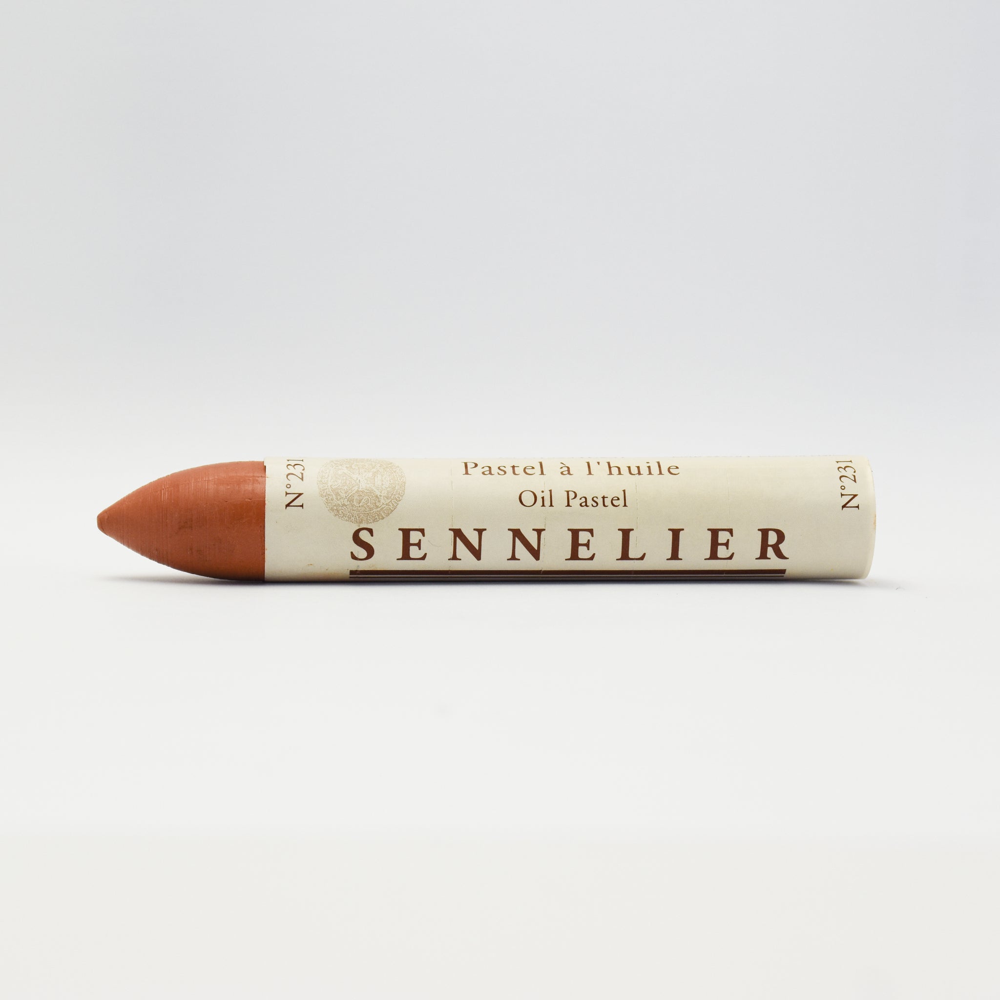 A single Sennelier oil pastel crayon against a white background, displaying the brand name and the word 'Oil Pastel' on the wrapper.