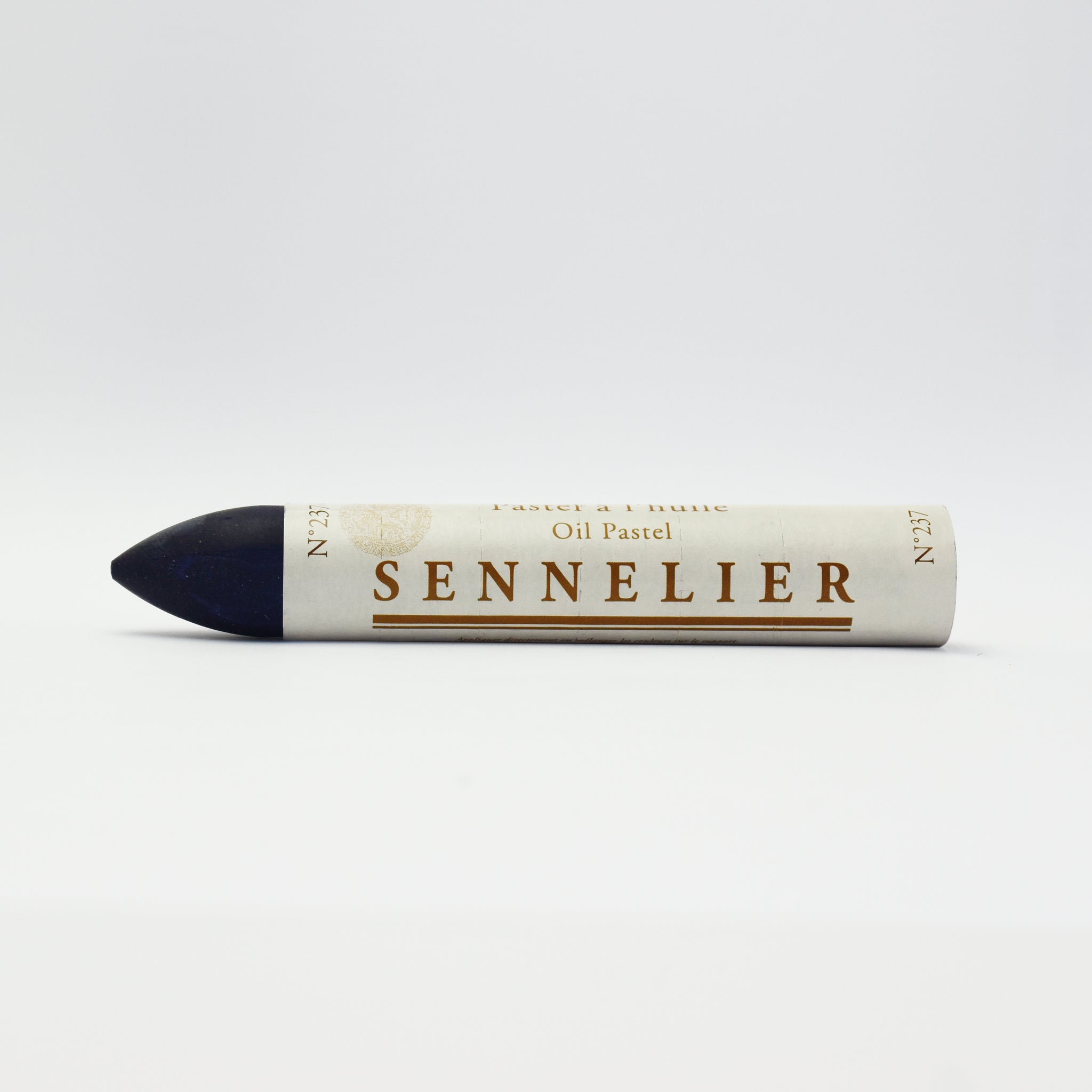 A single Sennelier oil pastel crayon against a white background, displaying the brand name and the word 'Oil Pastel' on the wrapper.