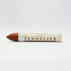 A single Sennelier oil pastel crayon against a white background, displaying the brand name and the word 'Oil Pastel' on the wrapper.