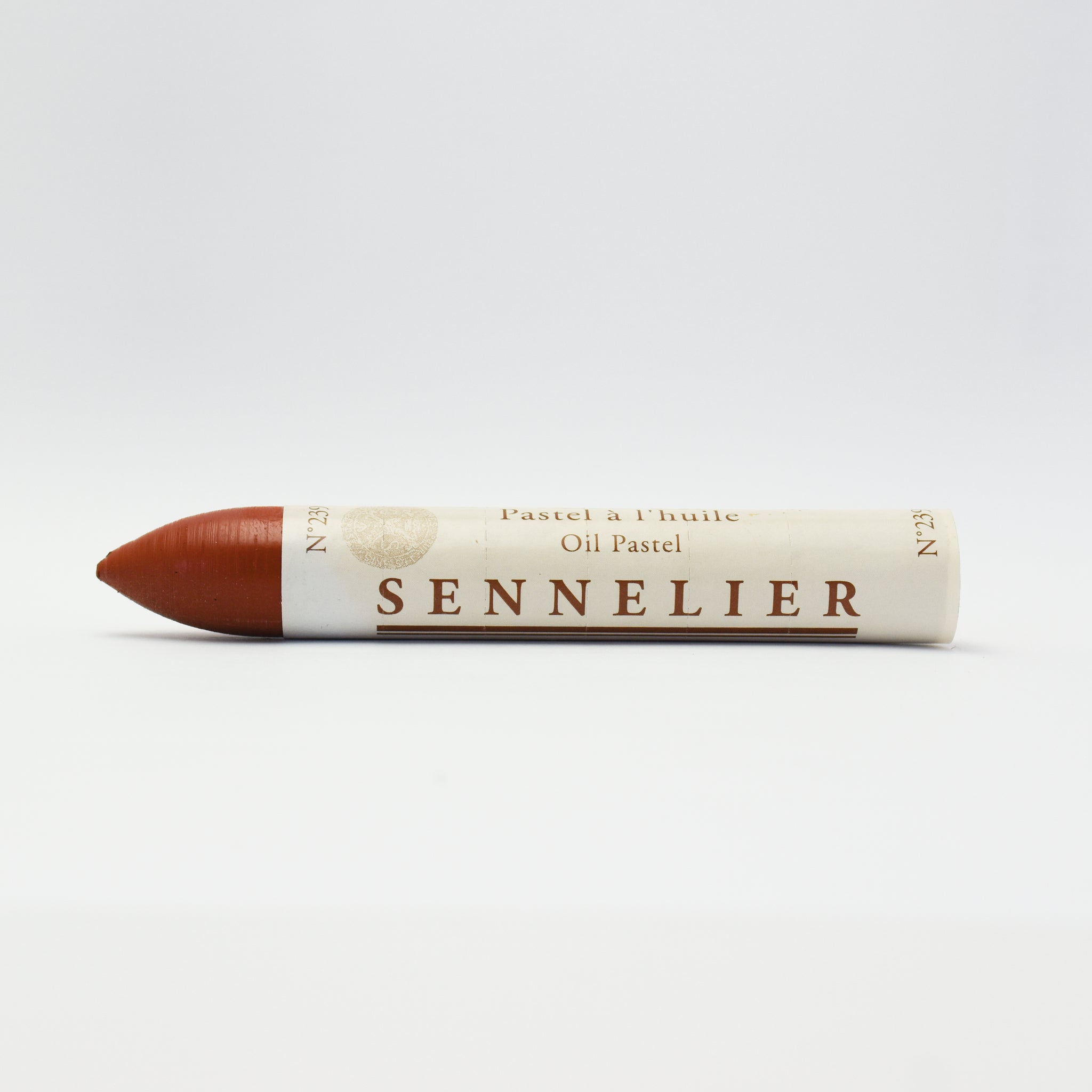A single Sennelier oil pastel crayon against a white background, displaying the brand name and the word 'Oil Pastel' on the wrapper.