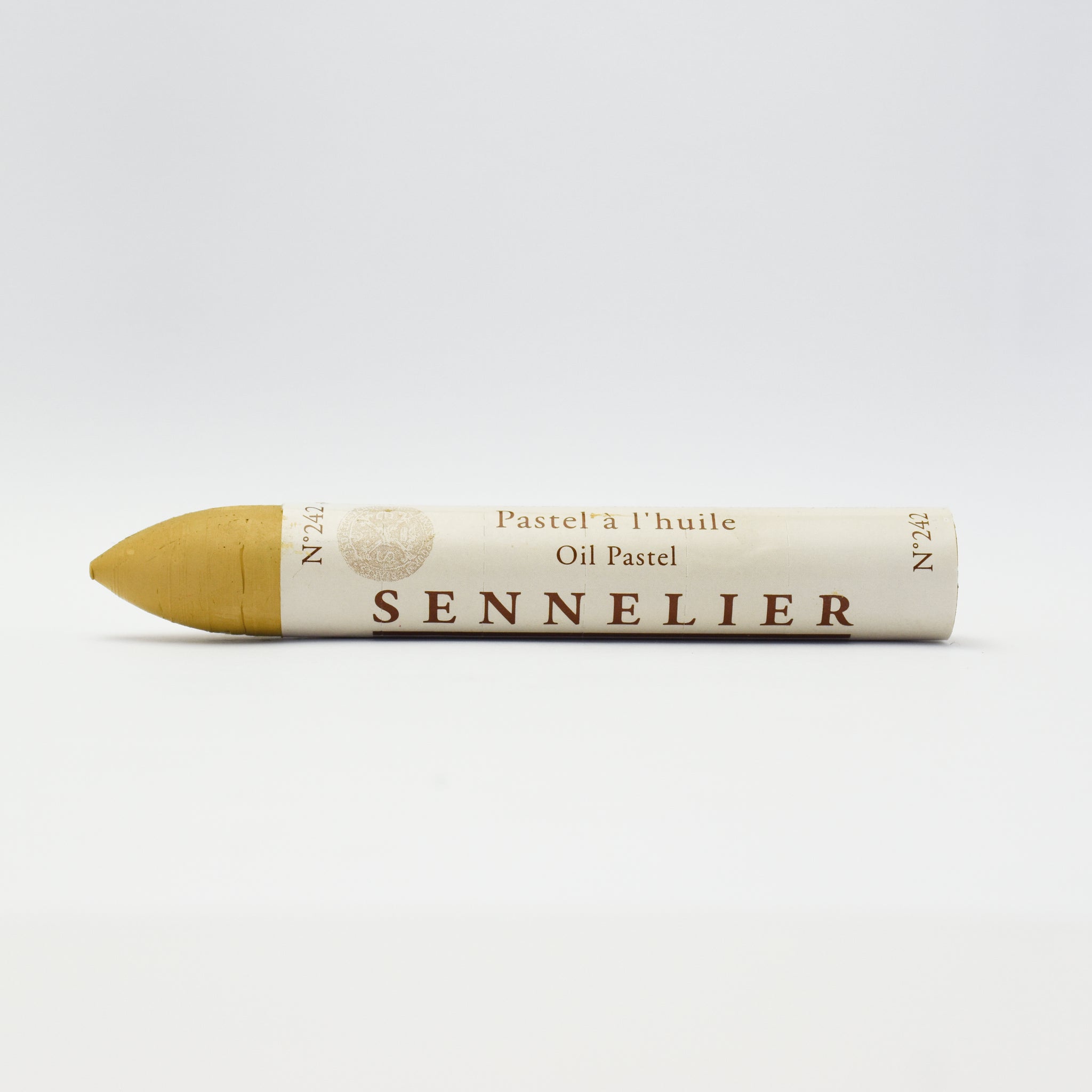 A single Sennelier oil pastel crayon against a white background, displaying the brand name and the word 'Oil Pastel' on the wrapper.