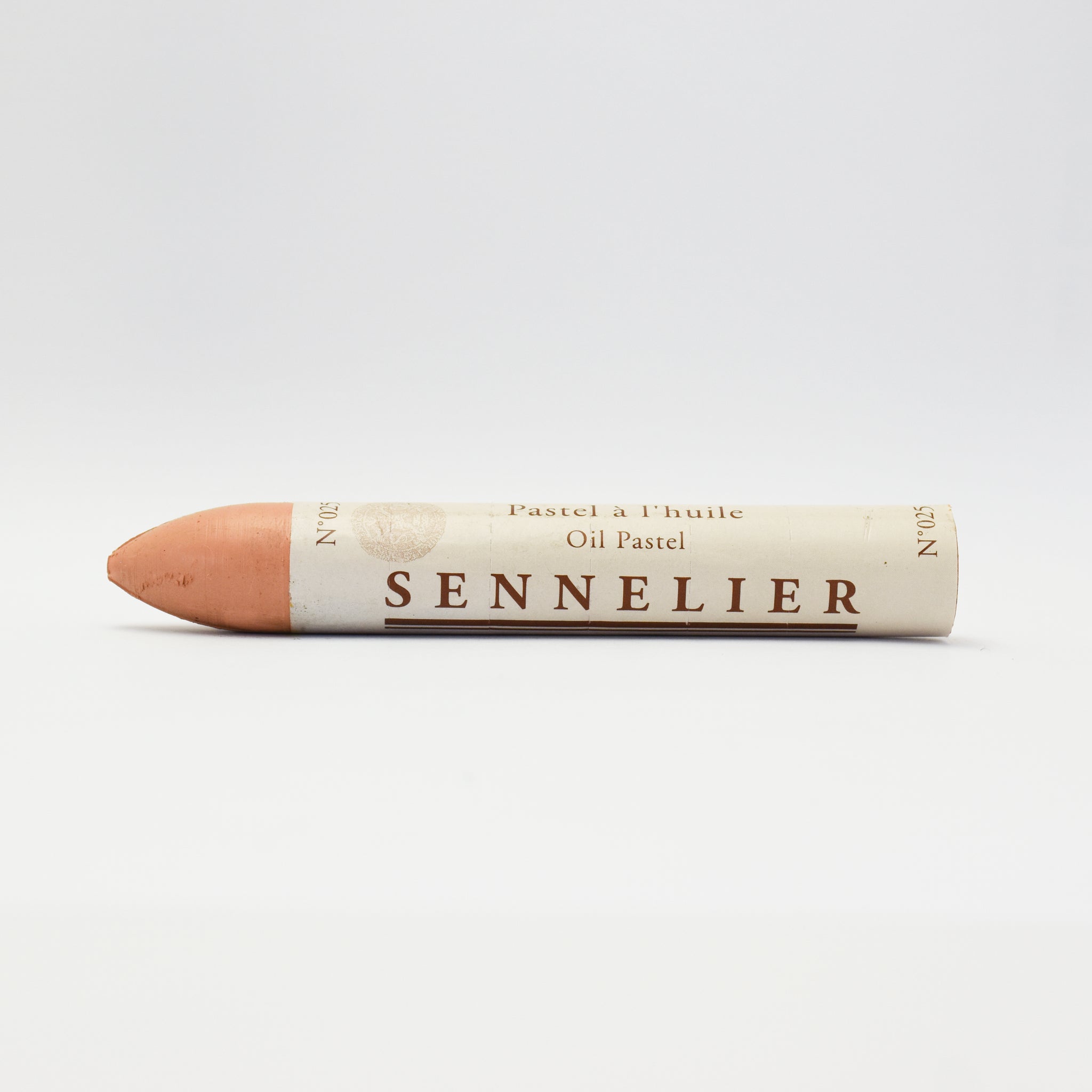 A single Sennelier oil pastel crayon against a white background, displaying the brand name and the word 'Oil Pastel' on the wrapper.