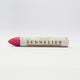 A single Sennelier oil pastel crayon against a white background, displaying the brand name and the word 'Oil Pastel' on the wrapper.
