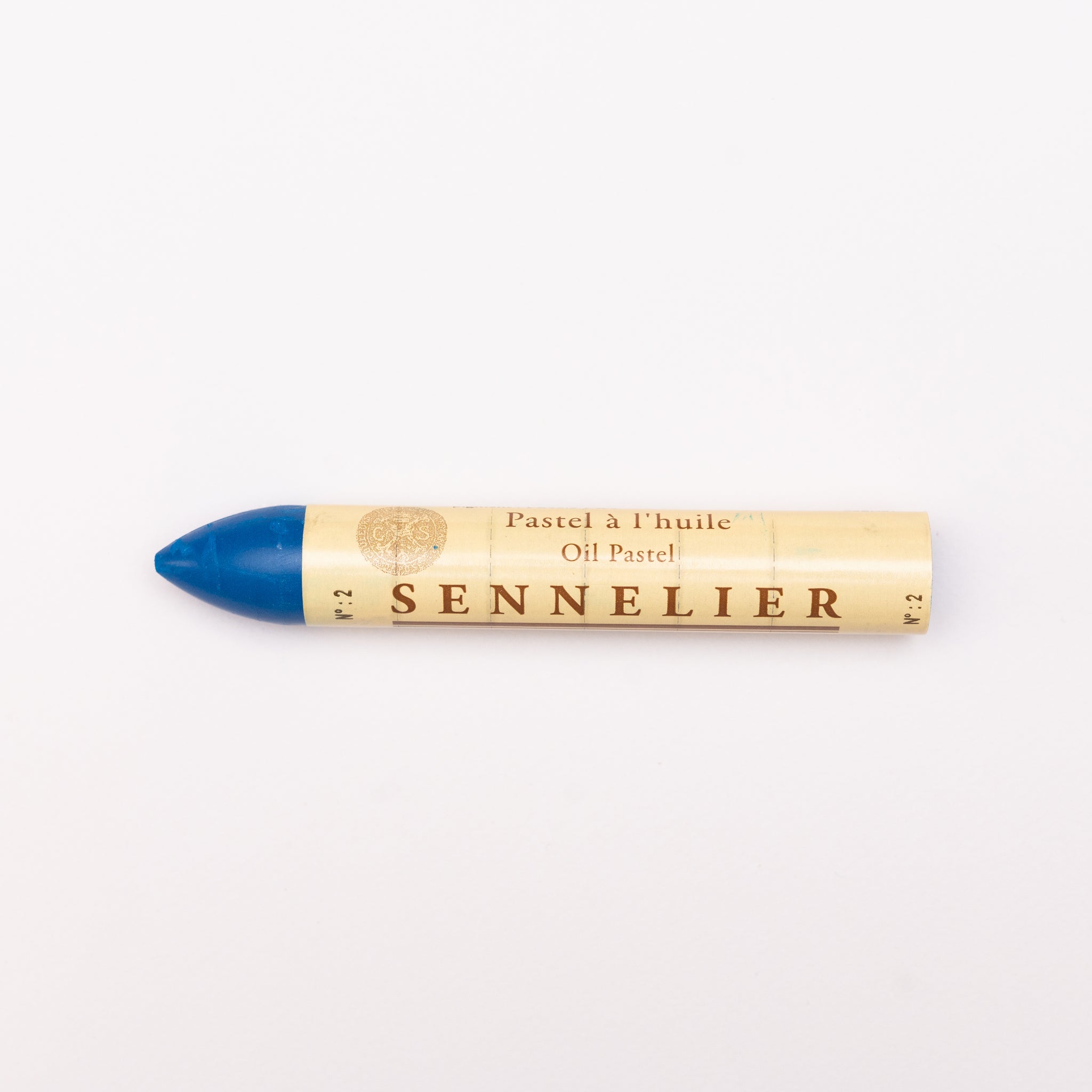 A single Sennelier oil pastel crayon against a white background, displaying the brand name and the word 'Oil Pastel' on the wrapper.