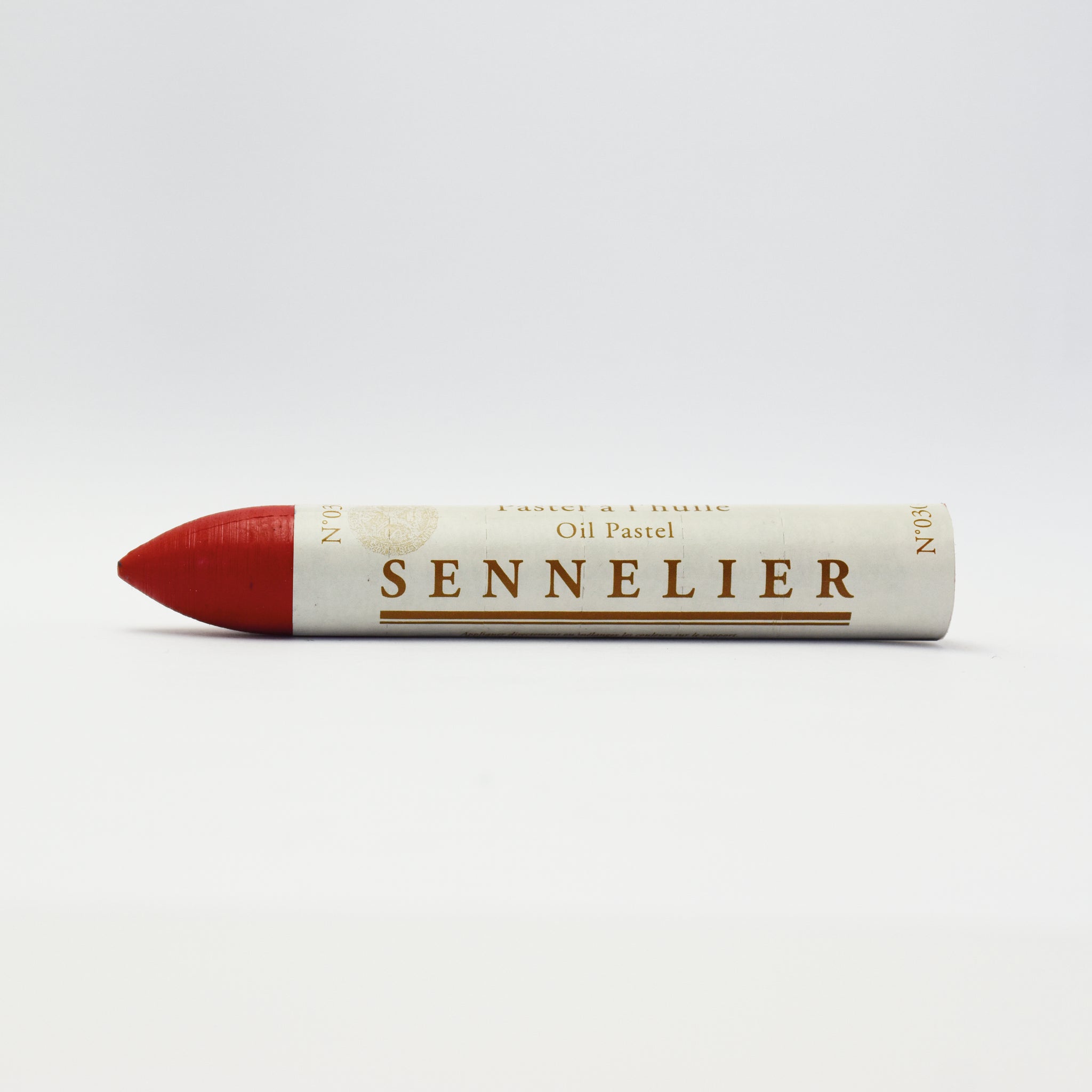 A single Sennelier oil pastel crayon against a white background, displaying the brand name and the word 'Oil Pastel' on the wrapper.