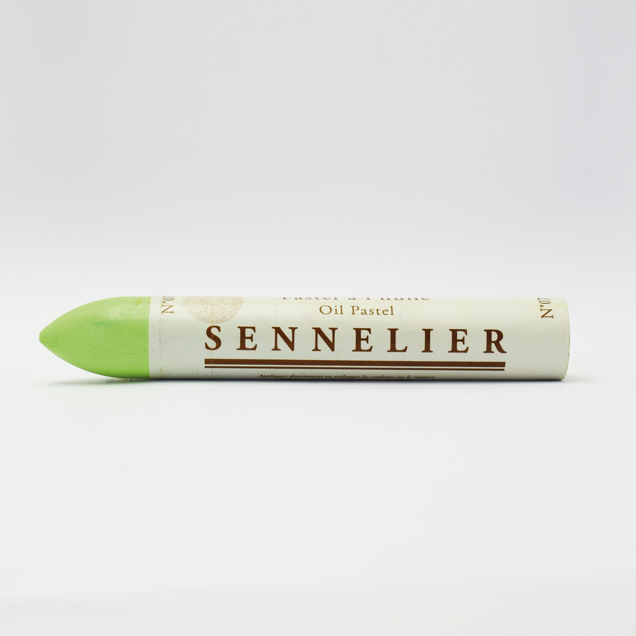 A single Sennelier oil pastel crayon against a white background, displaying the brand name and the word 'Oil Pastel' on the wrapper.