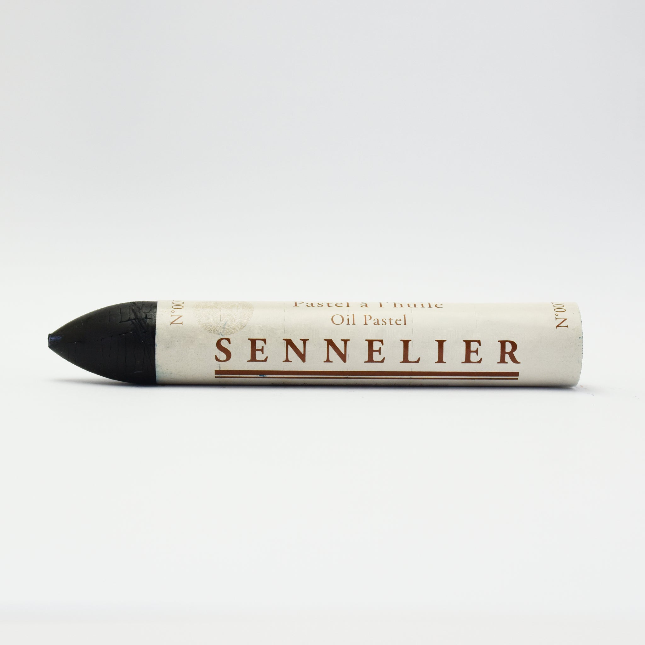 A single Sennelier oil pastel crayon against a white background, displaying the brand name and the word 'Oil Pastel' on the wrapper.