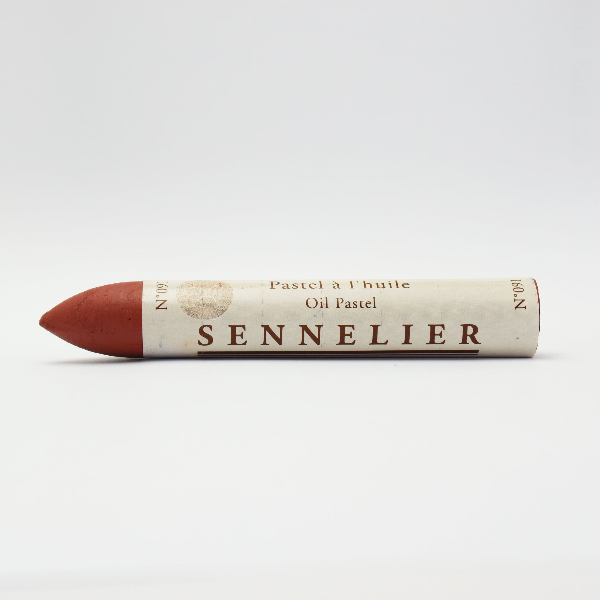 A single Sennelier oil pastel crayon against a white background, displaying the brand name and the word 'Oil Pastel' on the wrapper.