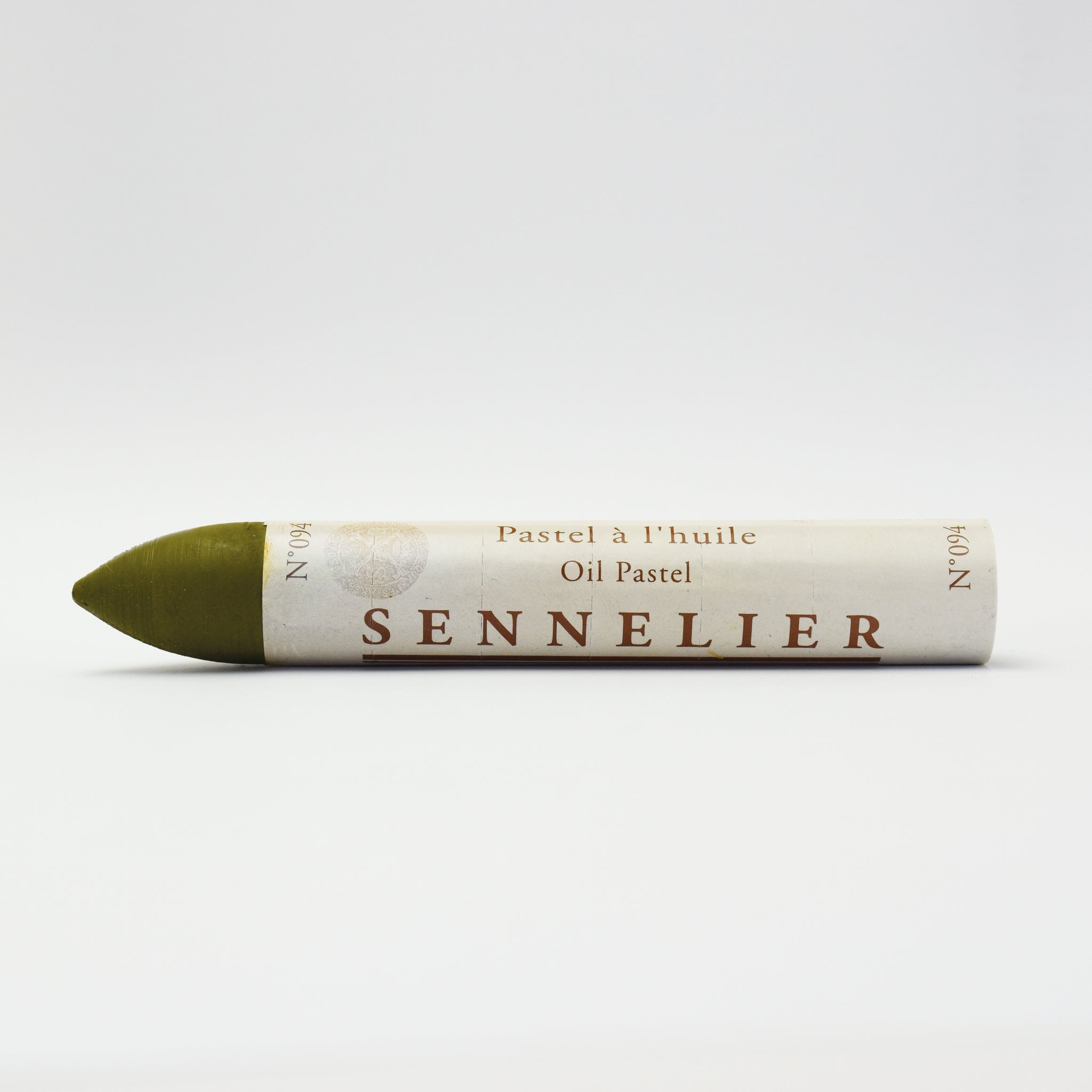 A single Sennelier oil pastel crayon against a white background, displaying the brand name and the word 'Oil Pastel' on the wrapper.