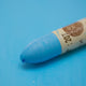 A close-up of a Sennelier oil pastel on a  blue background.