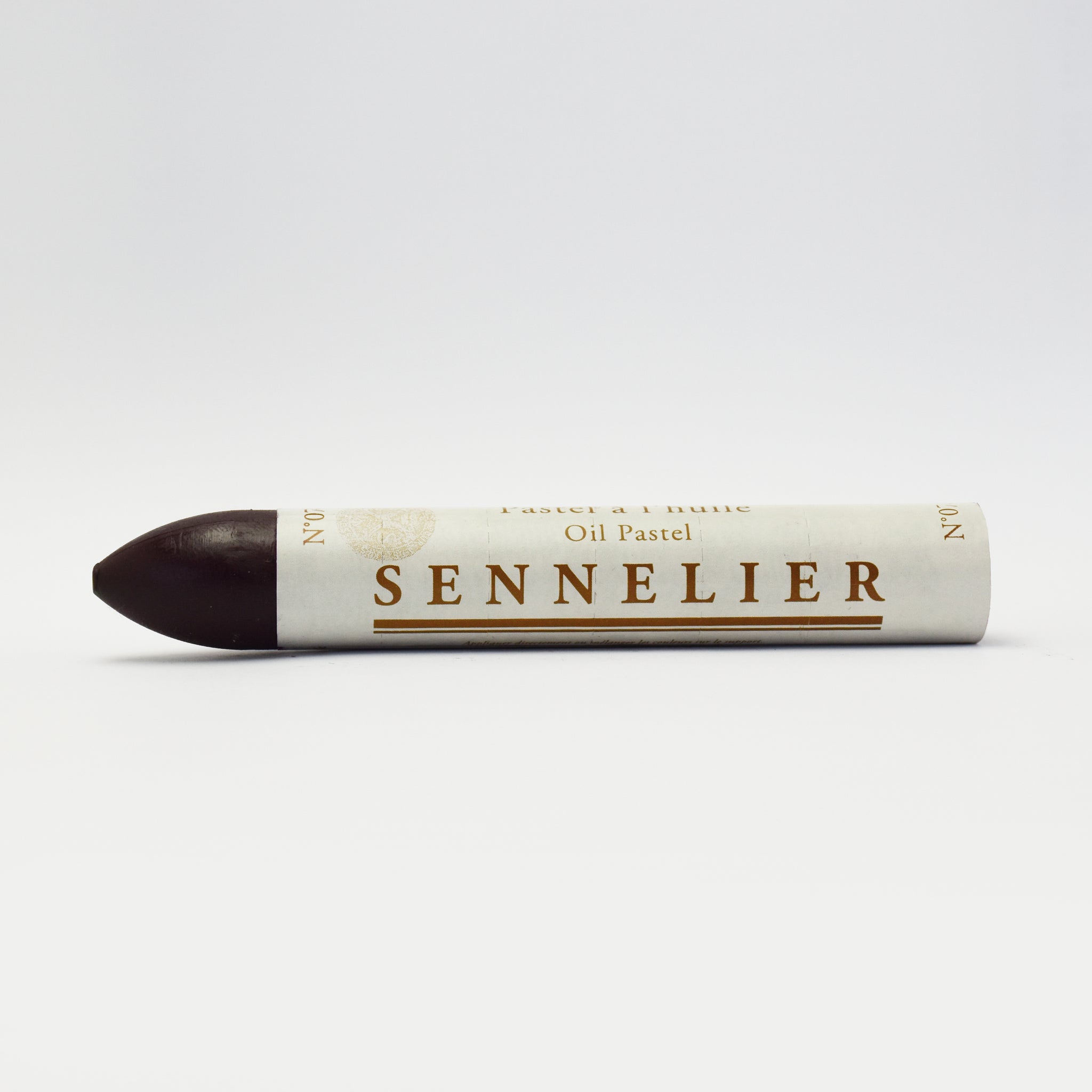 A single Sennelier oil pastel crayon against a white background, displaying the brand name and the word 'Oil Pastel' on the wrapper.
