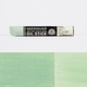 Sennelier oil stick packaging with a green colour swatch on a white background