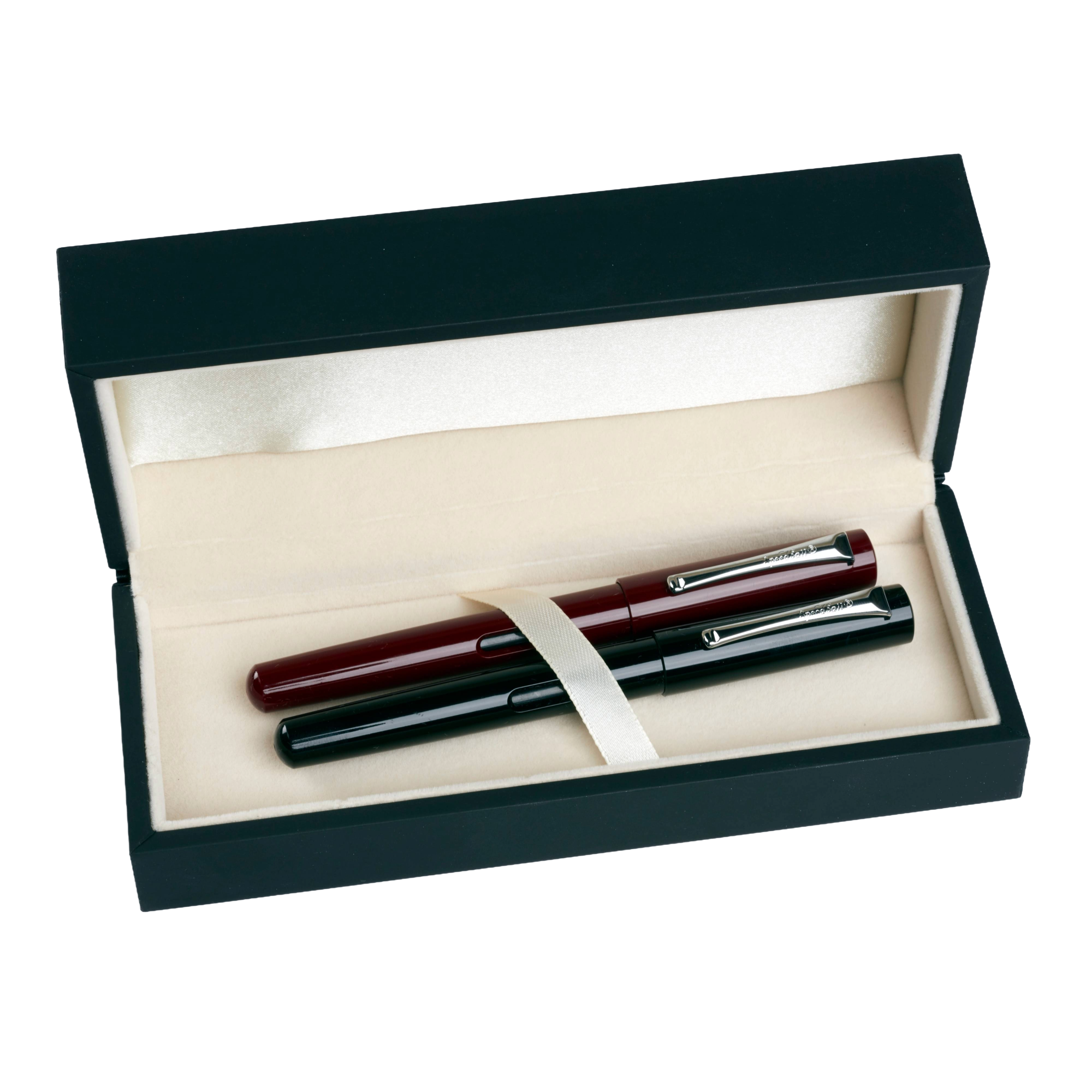 Two pens in a dark blue box with a white interior