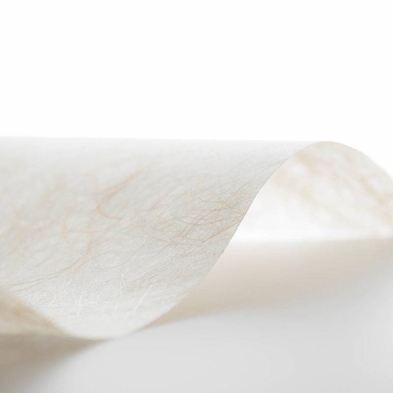A close-up image of a piece of Kinwashi decorative paper with a visible hemp fiber texture.