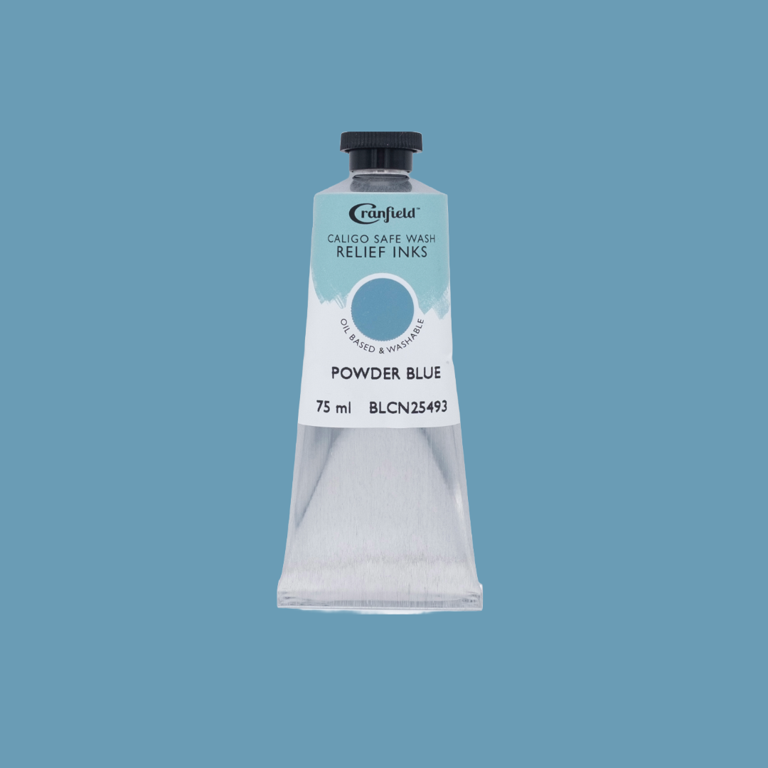 A tube of Powder Blue Caligo Safe Wash Relief Ink on a Powder Blue background