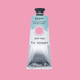 A tube of Soft Pink Caligo Safe Wash Relief Ink on a Soft Pink background
