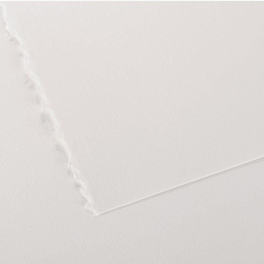 A close-up image of a Canson Editioning Paper with a focus on its light texture and showing one deckled edge and one cut edge.