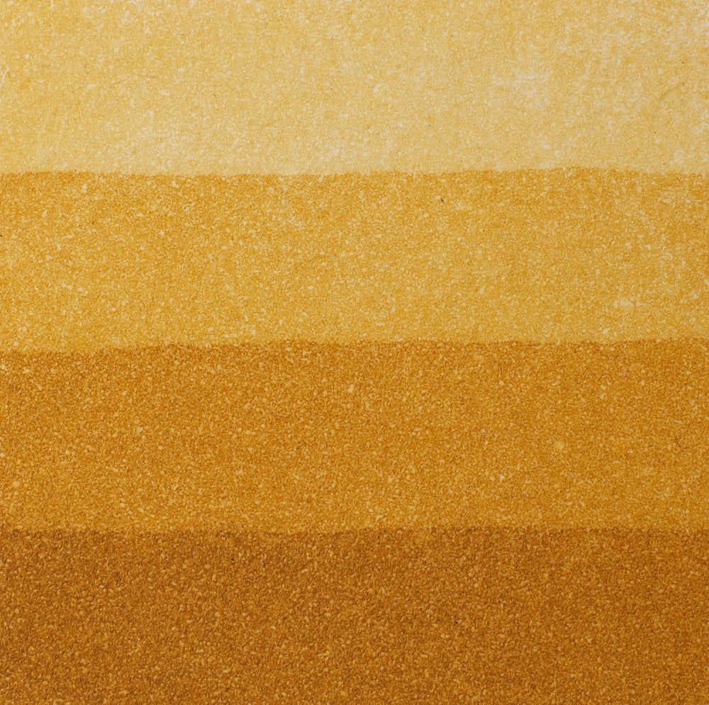 An aquatint test print in yellow ochre showing 4 depths of tone.