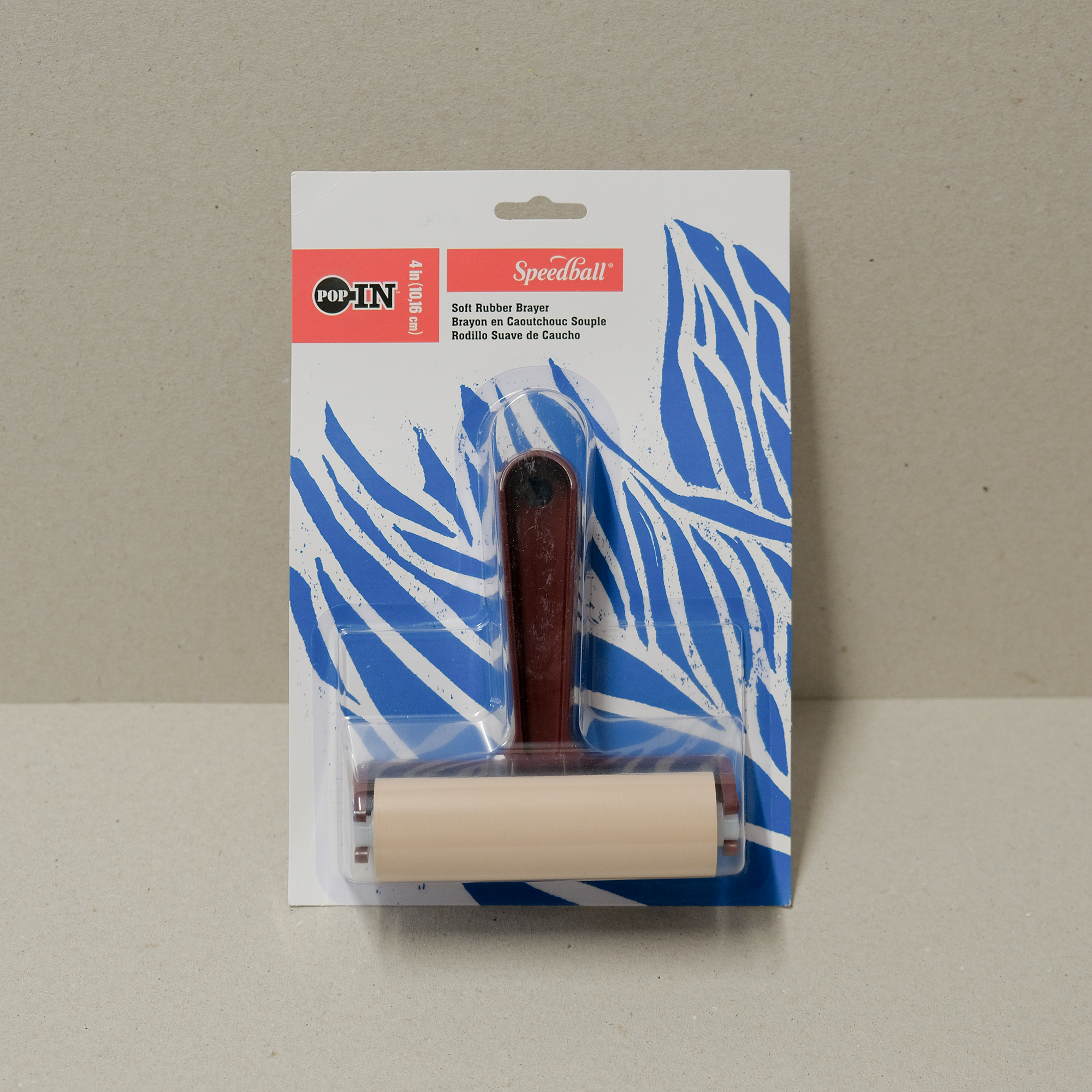 Speedball economy roller with a plastic comfort grip handle, packaged in a card with a blue abstract pattern.