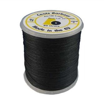 A spool of black bookbinding thread made by Coats Barbour, displayed against a white background.