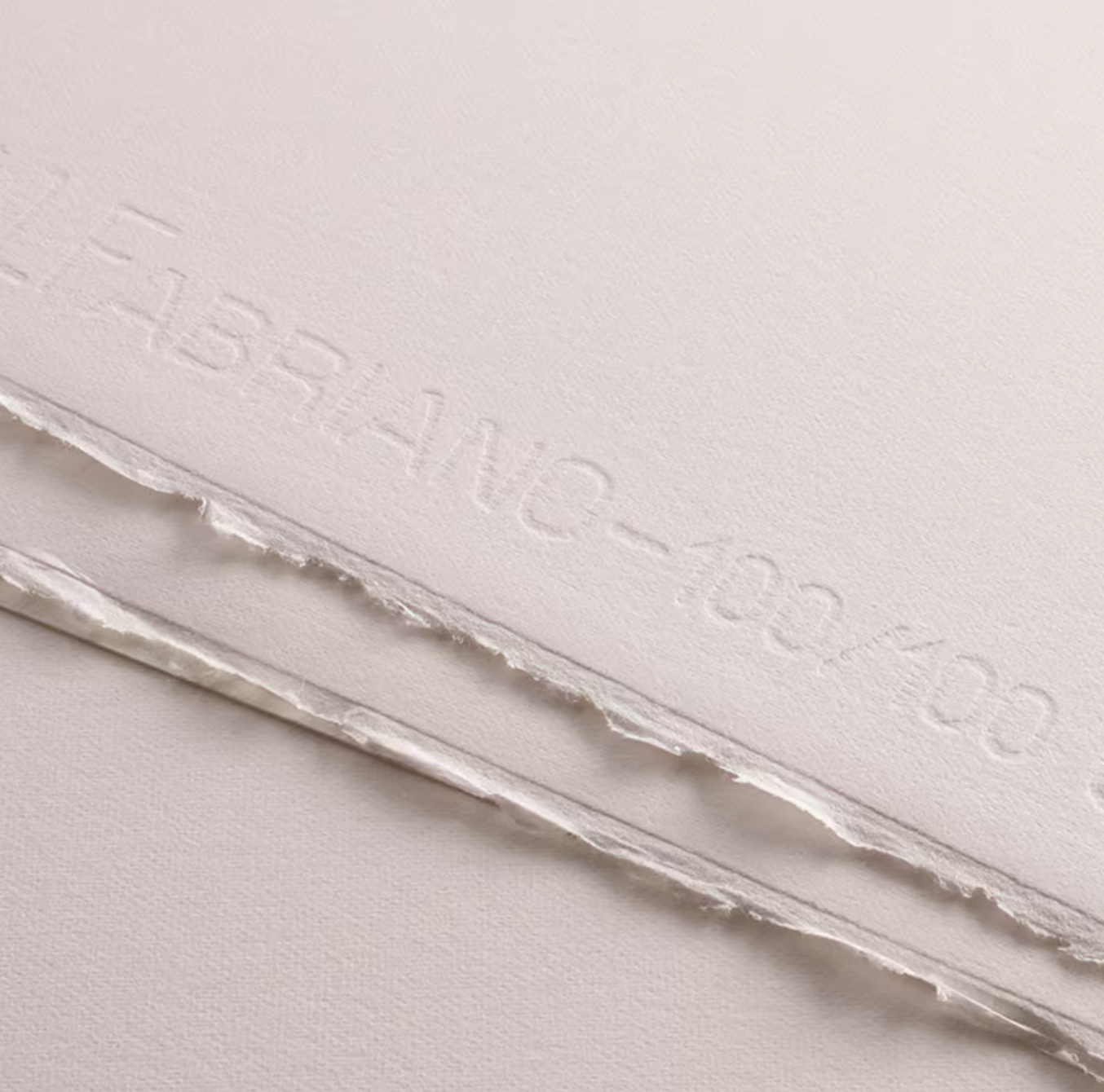 Close-up of Fabriano Tiepolo paper showing the watermark and deckled edges.