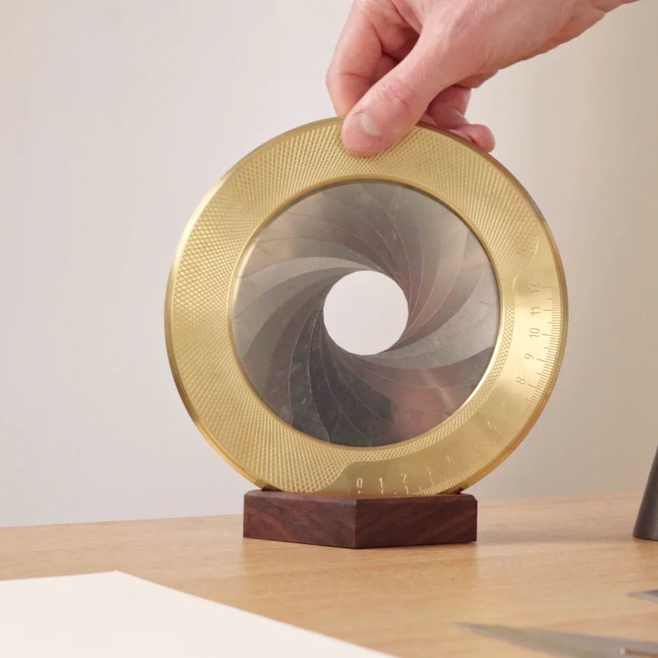 Makers Cabinet Large Format Drawing Compass Sitting up in the Walnut Base on table.