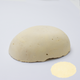 A half egg shaped pastel in an off-white tone, sitting on a white background with a drawn colour swatch.