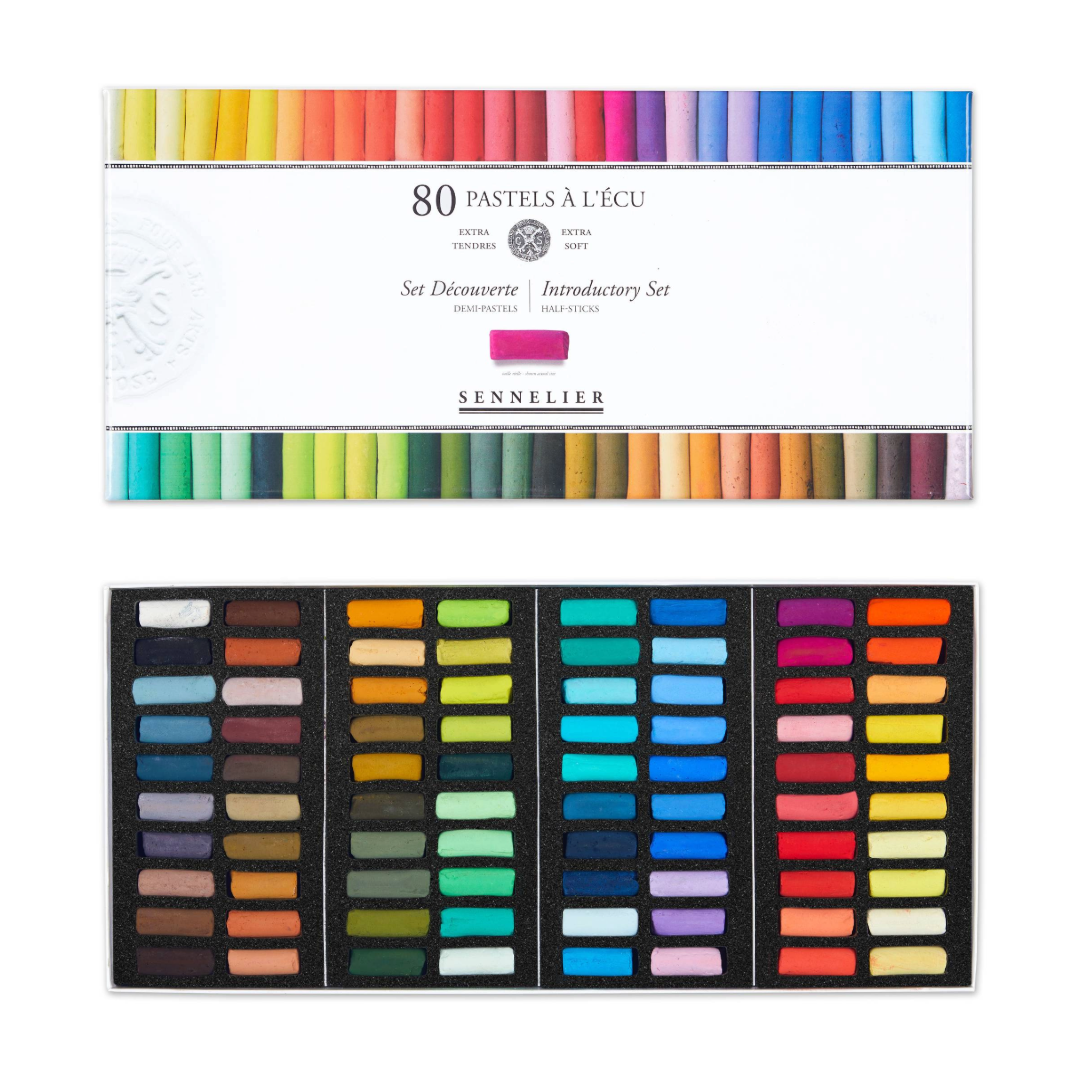 A set of 80 Sennelier Extra Soft Half Pastels in a variety of colours. Displayed in an open cardboard box with Sennelier packaging on a White background