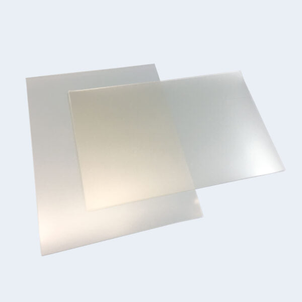 Two stacks of transparent rectangular sheets on a light grey background