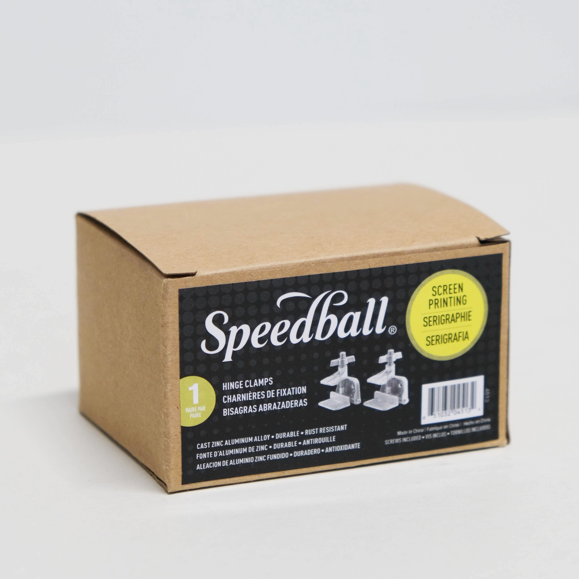 Cardboard box containing screenprinting hinge clamps with Speedball branding on a white background