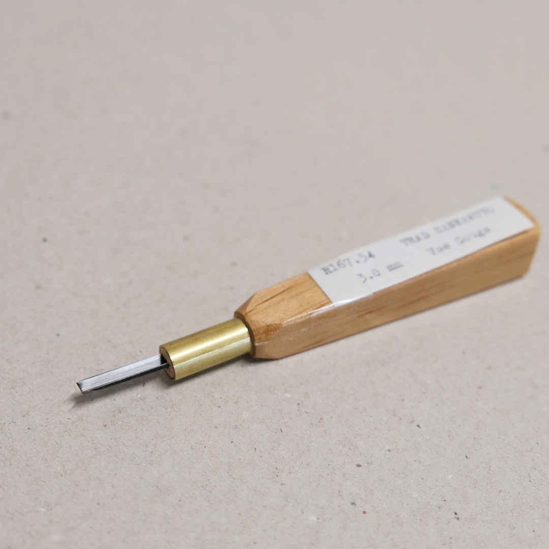 A traditional Japanese 'V' carving tool with a wooden handle and a high-grade steel blade.