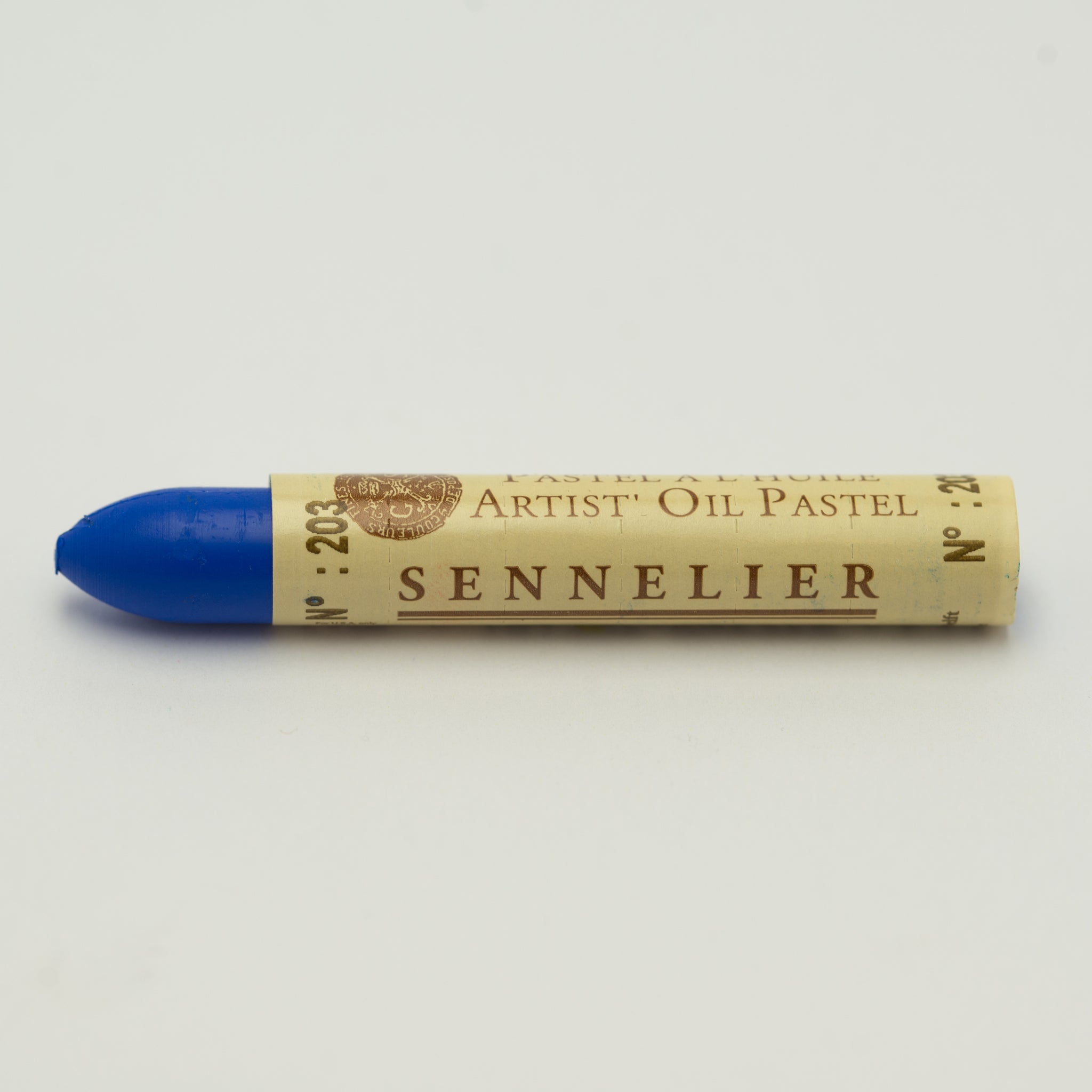 A single Sennelier oil pastel crayon against a white background, displaying the brand name and the words 'Artist Oil Pastel' on the wrapper.
