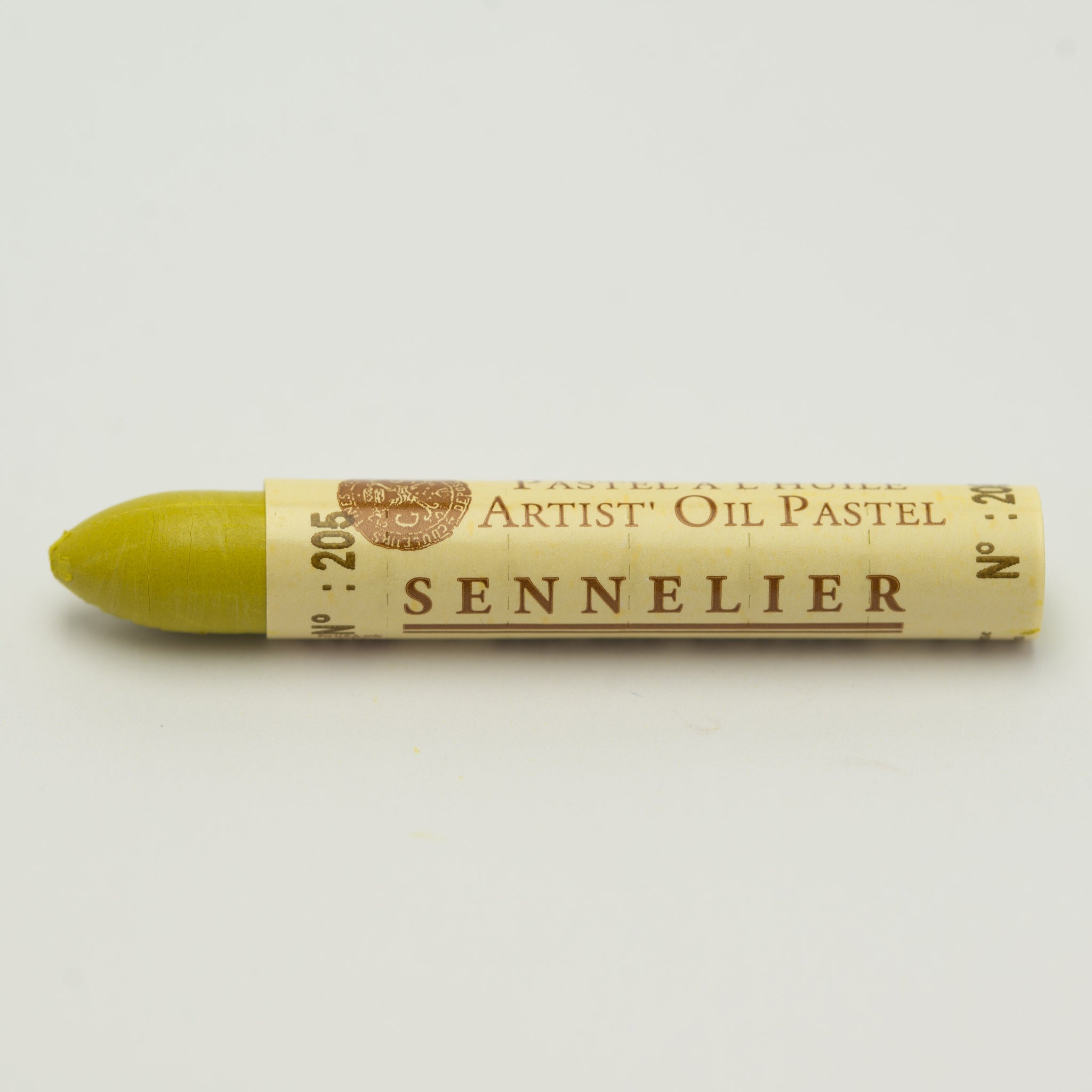 A single Sennelier oil pastel crayon against a white background, displaying the brand name and the words 'Artist Oil Pastel' on the wrapper.