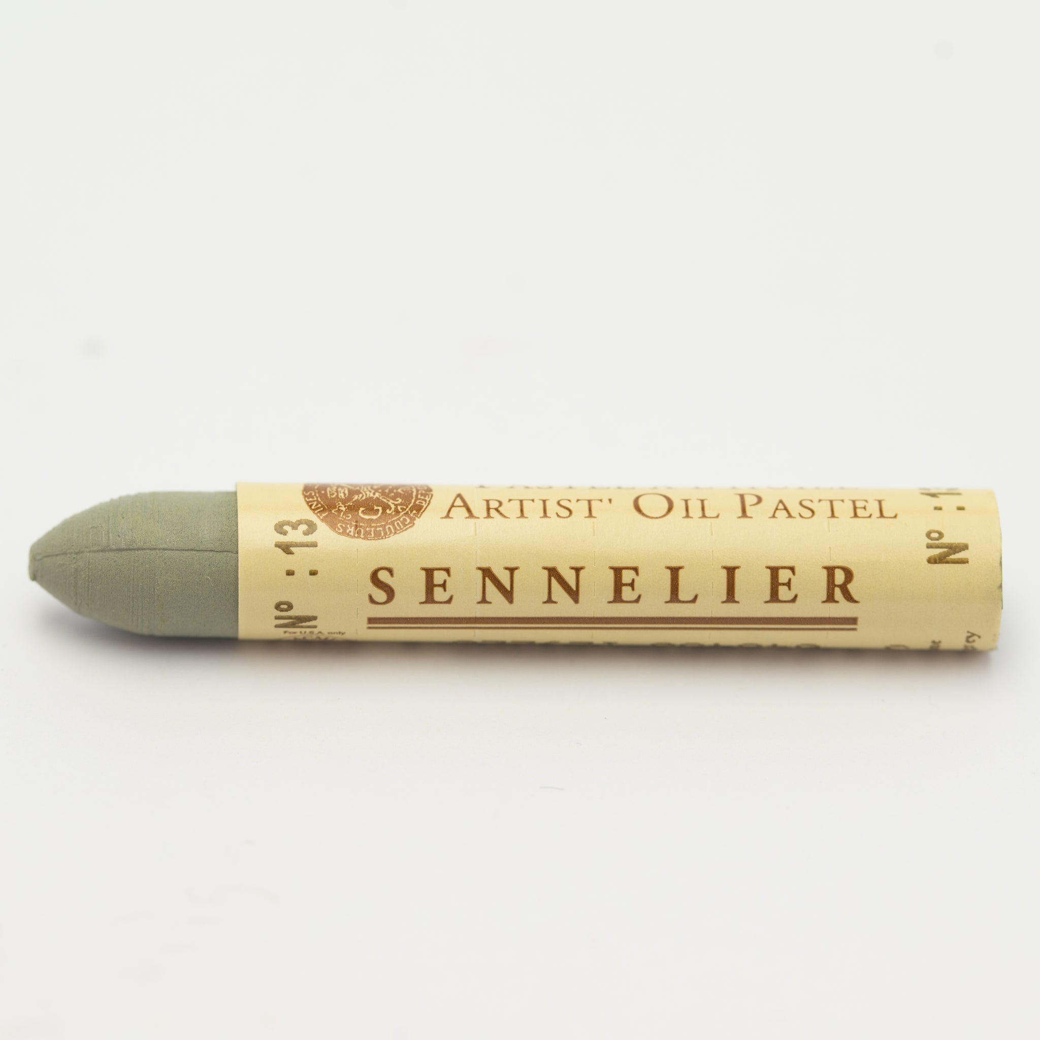 A single Sennelier oil pastel crayon against a white background, displaying the brand name and the words 'Artist Oil Pastel' on the wrapper.