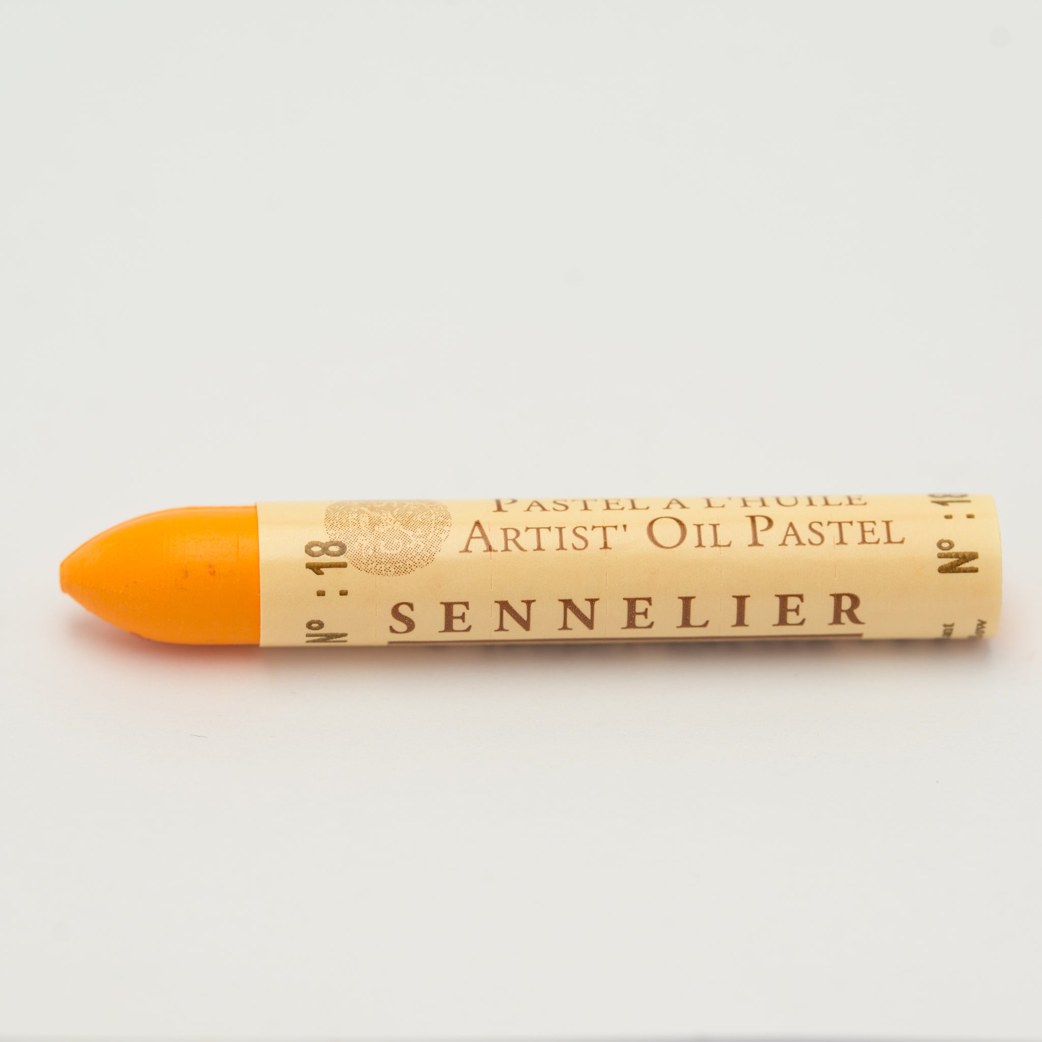 A single Sennelier oil pastel crayon against a white background, displaying the brand name and the words 'Artist Oil Pastel' on the wrapper.