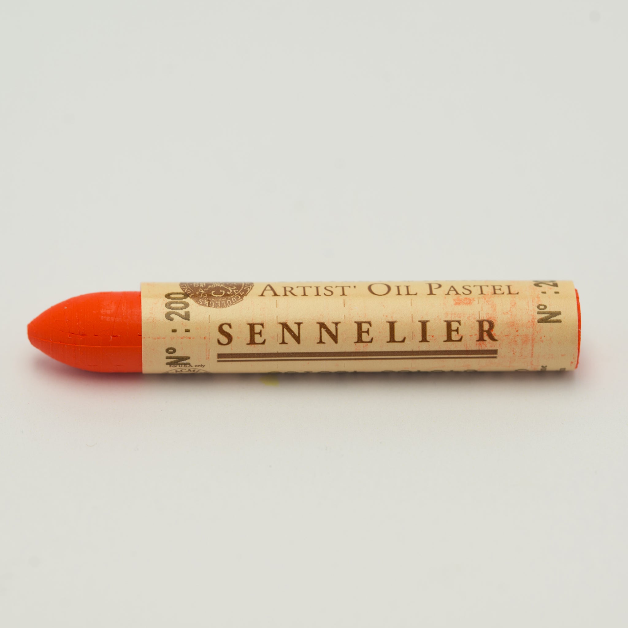 A single Sennelier oil pastel crayon against a white background, displaying the brand name and the words 'Artist Oil Pastel' on the wrapper.