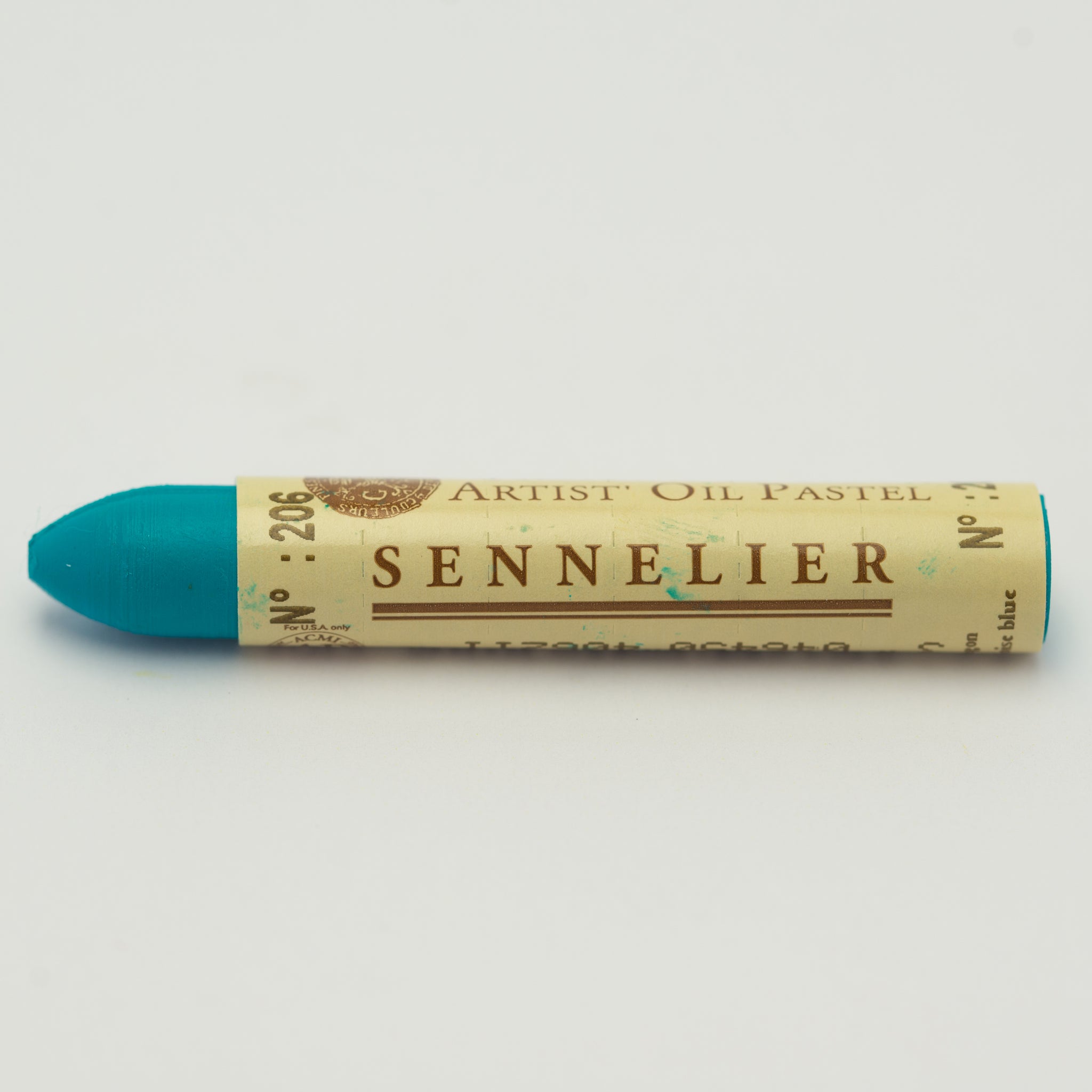 A single Sennelier oil pastel crayon against a white background, displaying the brand name and the words 'Artist Oil Pastel' on the wrapper.