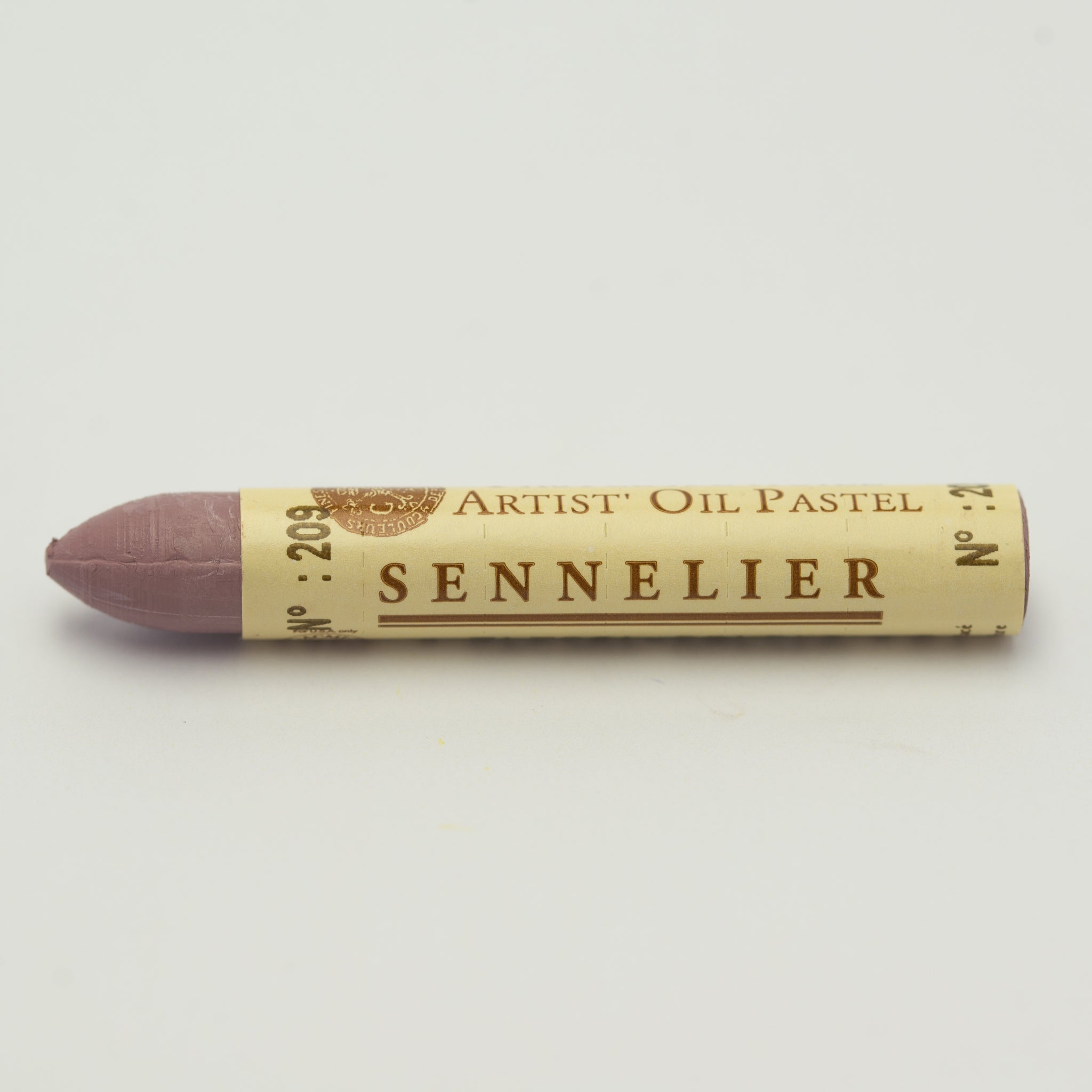 A single Sennelier oil pastel crayon against a white background, displaying the brand name and the words 'Artist Oil Pastel' on the wrapper.
